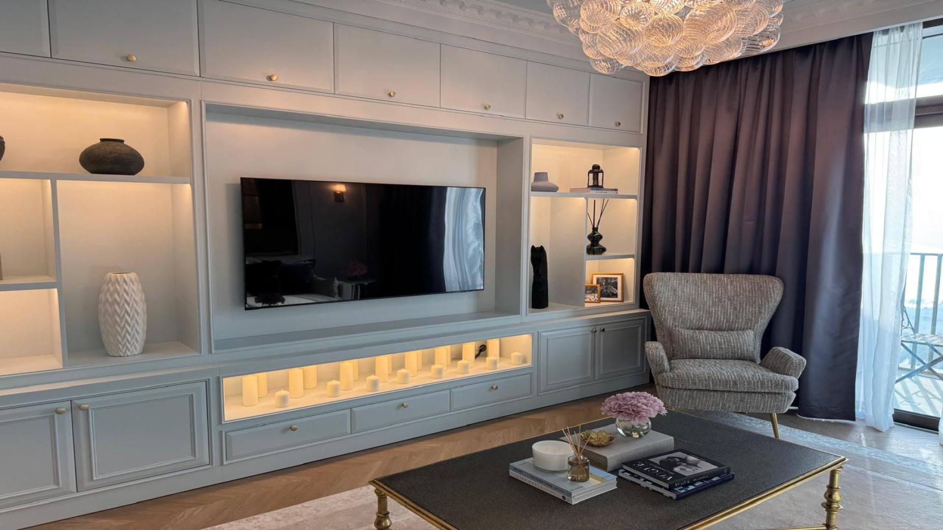 Luxurious living room in Dubai Creek Harbour apartment, elegant decor, spacious seating area