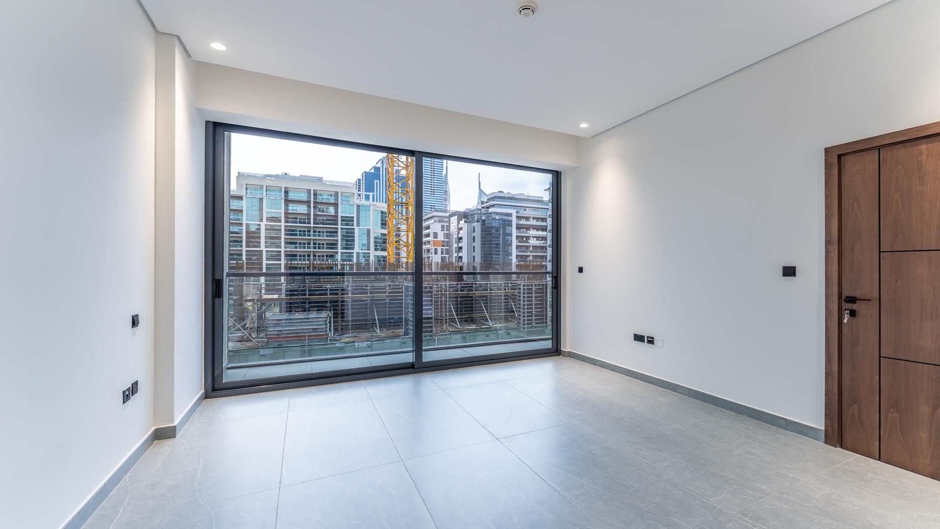 Modern kitchen and living area in Arista One apartment, Al Satwa, available for sale