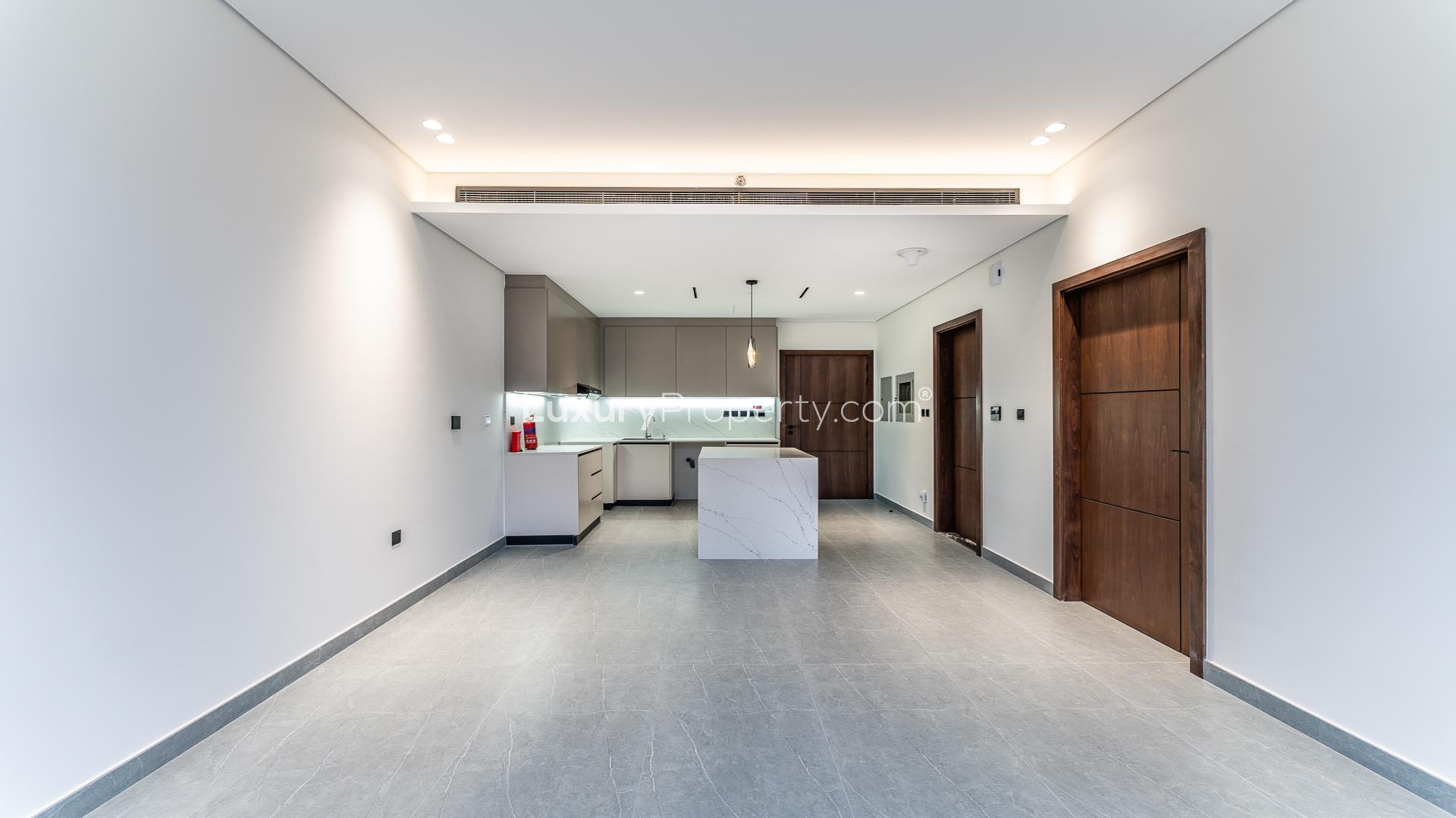 Modern living area with large windows in Arista One apartment, Al Satwa, for sale