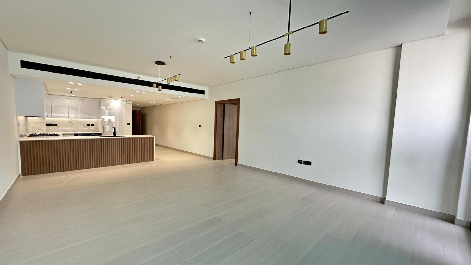 Unfurnished open-plan kitchen and living area in Binghatti Galaxy, JVC apartment for sale
