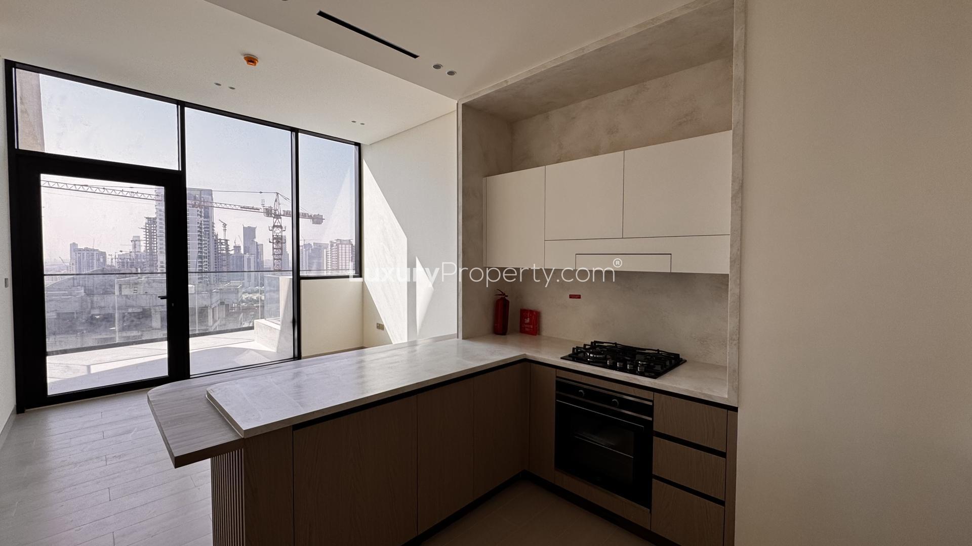 High-floor apartment kitchen in Binghatti Phantom, JVC with modern design and open layout
