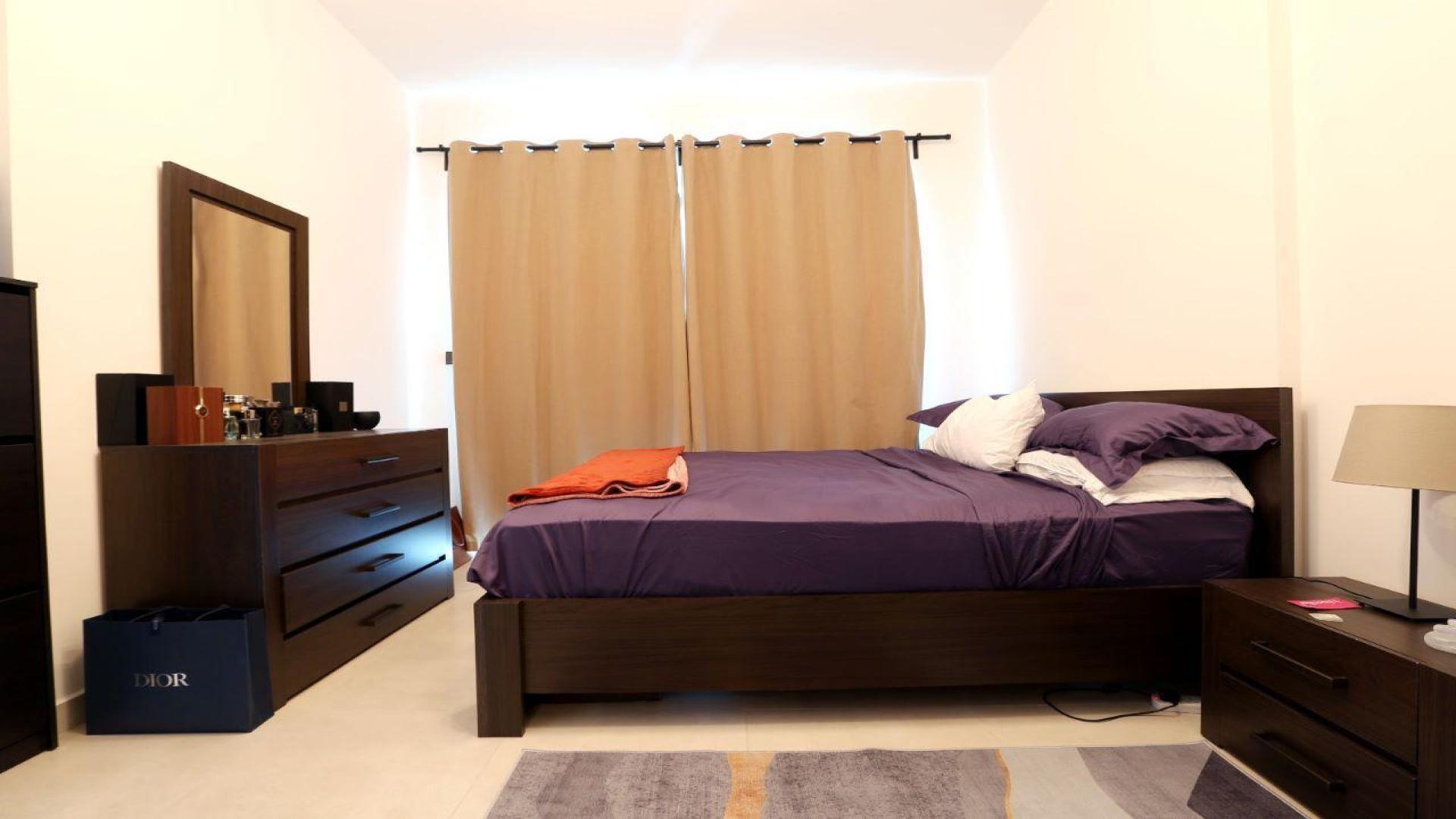 Modern bedroom with wooden furniture in JVC apartment for sale, LP47810