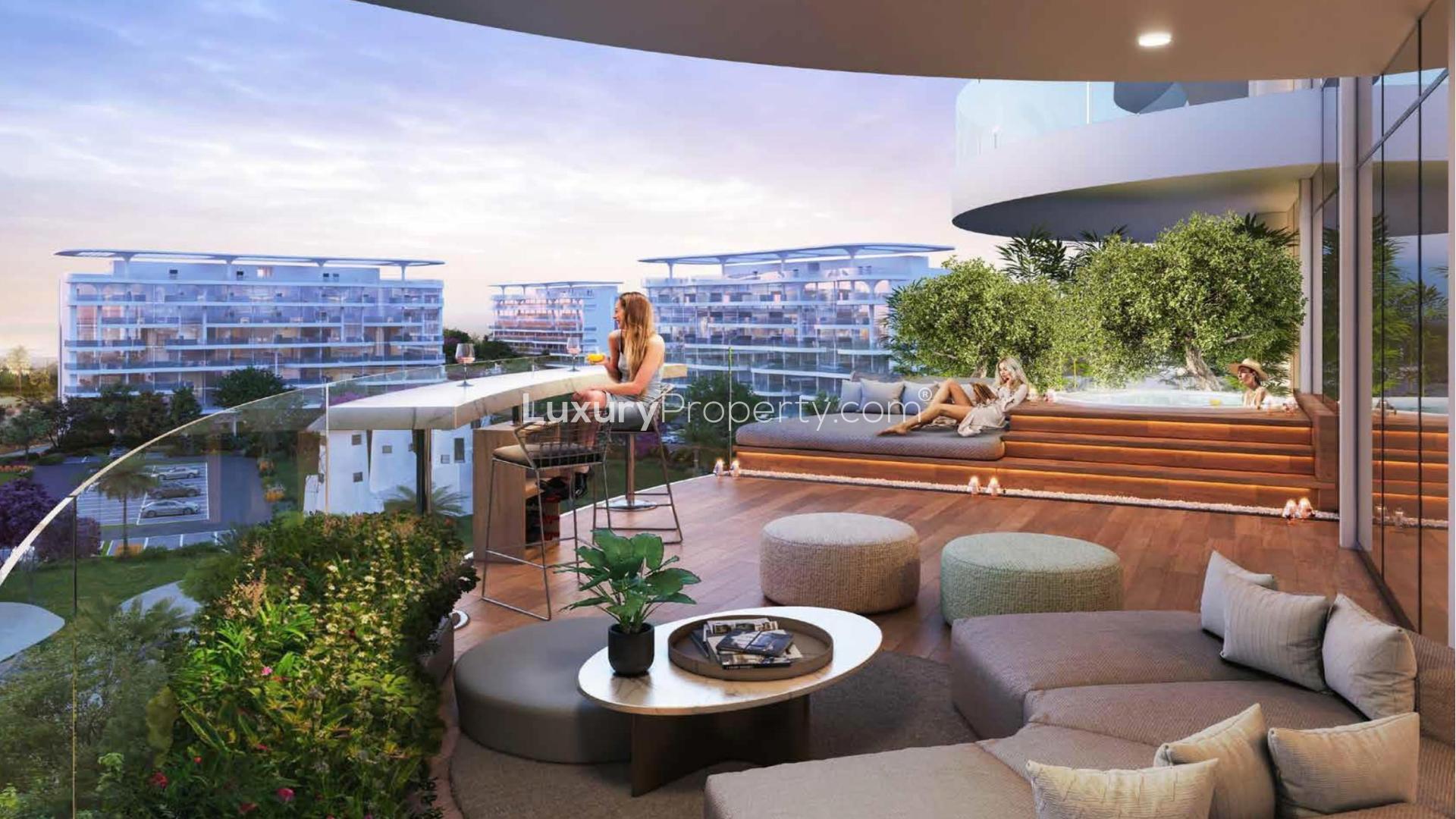 Modern apartment buildings in Damac Lagoon Views community with lush gardens and recreational area