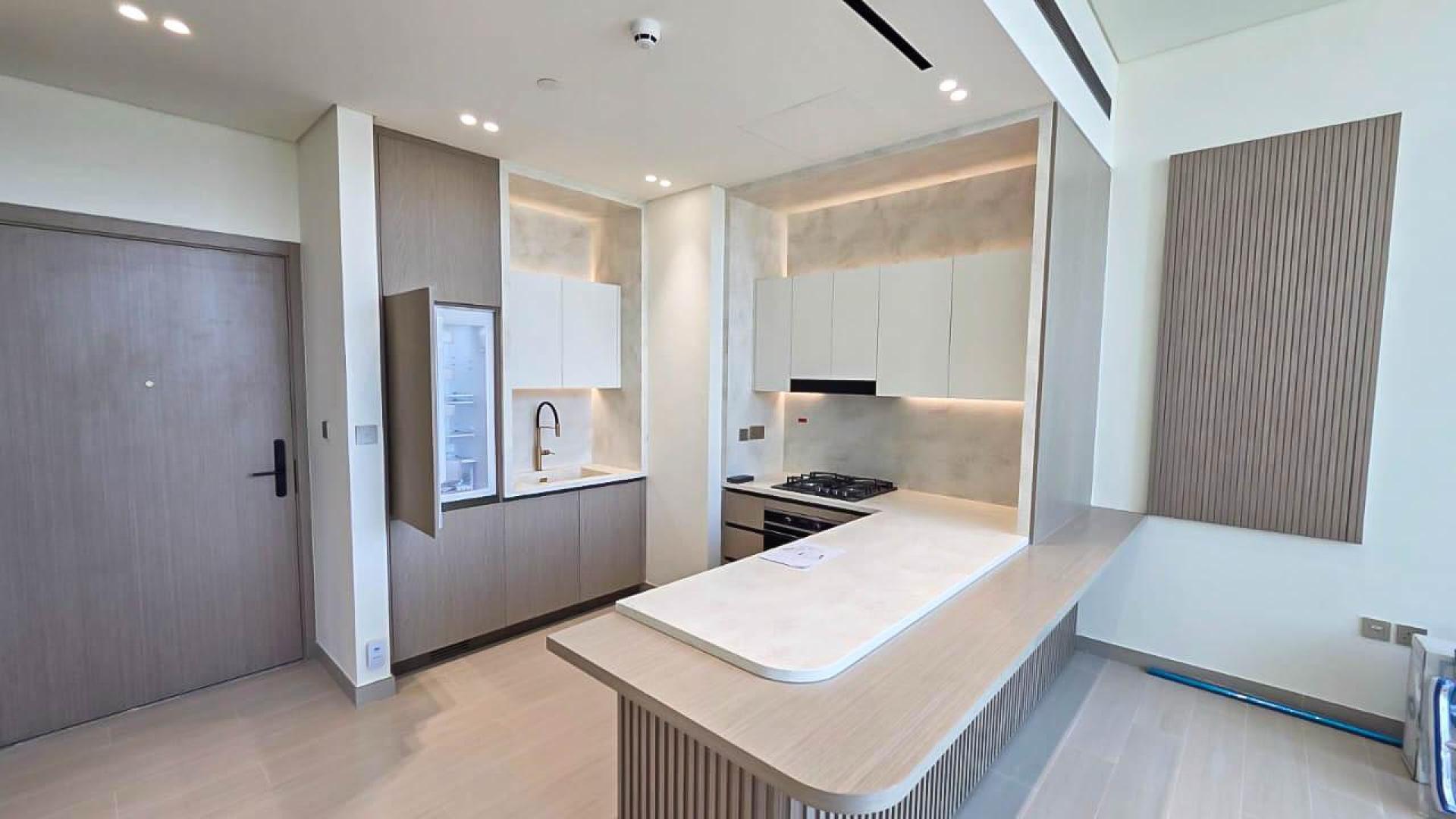 "Luxurious pool view at Binghatti Royale apartment for sale in JVC community.",Modern kitchen in spacious JVC apartment, Binghatti Royale, for sale, LP48099