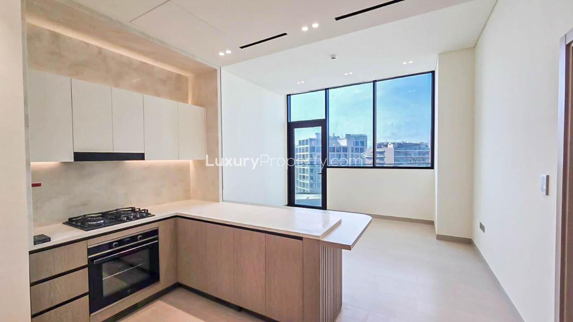 Spacious kitchen with modern design in JVC Binghatti Royale apartment for sale