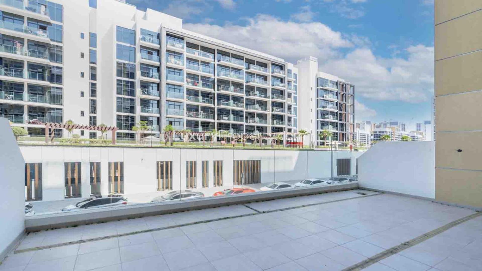 "Modern kitchen in spacious 1-bed apartment, Azizi Riviera, Meydan, high ROI property for sale.",Spacious balcony view of Azizi Riviera apartment in Meydan, available for sale