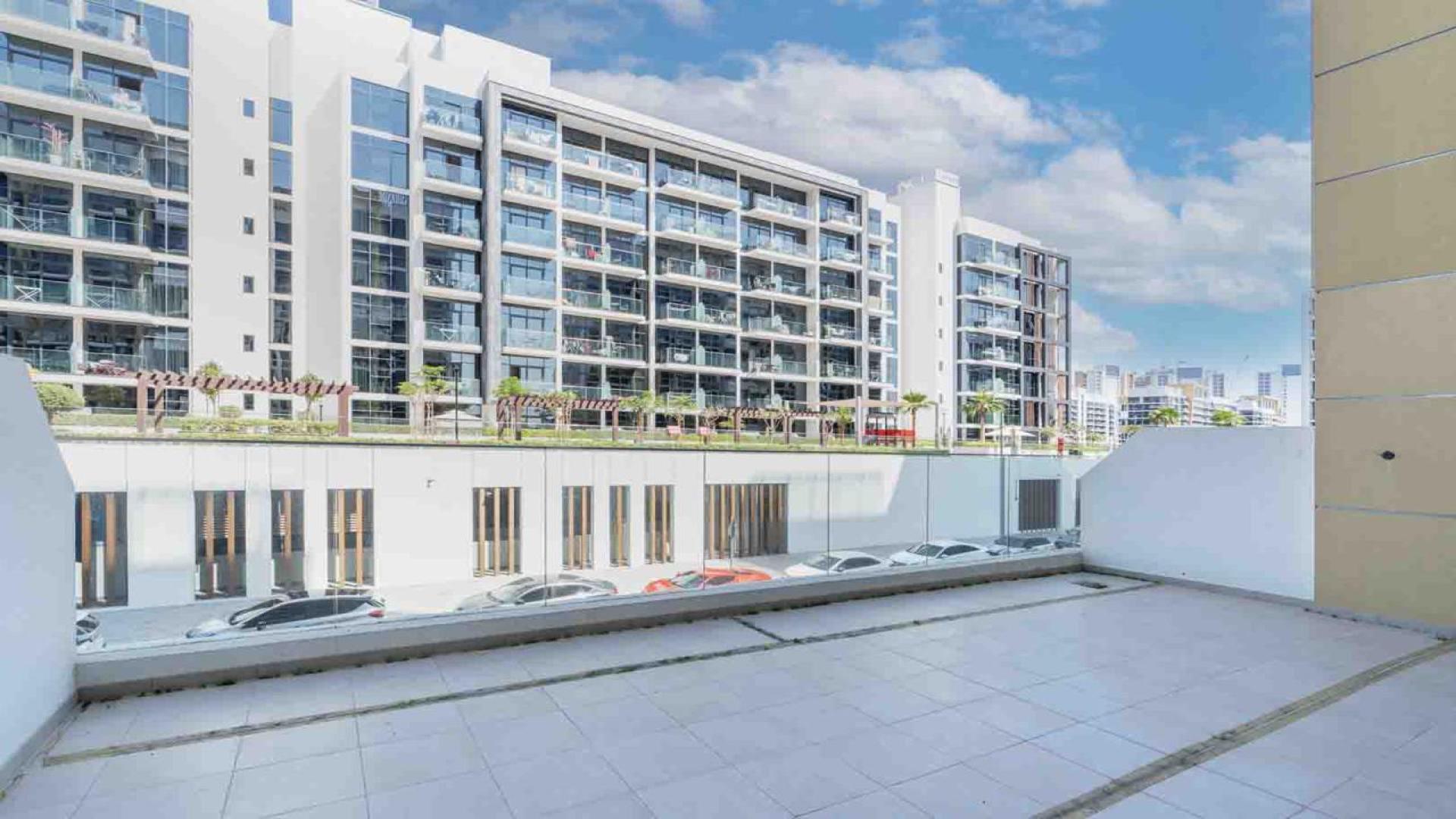 "Modern kitchen in spacious 1-bed apartment, Azizi Riviera, Meydan, high ROI property for sale.",Spacious balcony view of Azizi Riviera apartment in Meydan, available for sale