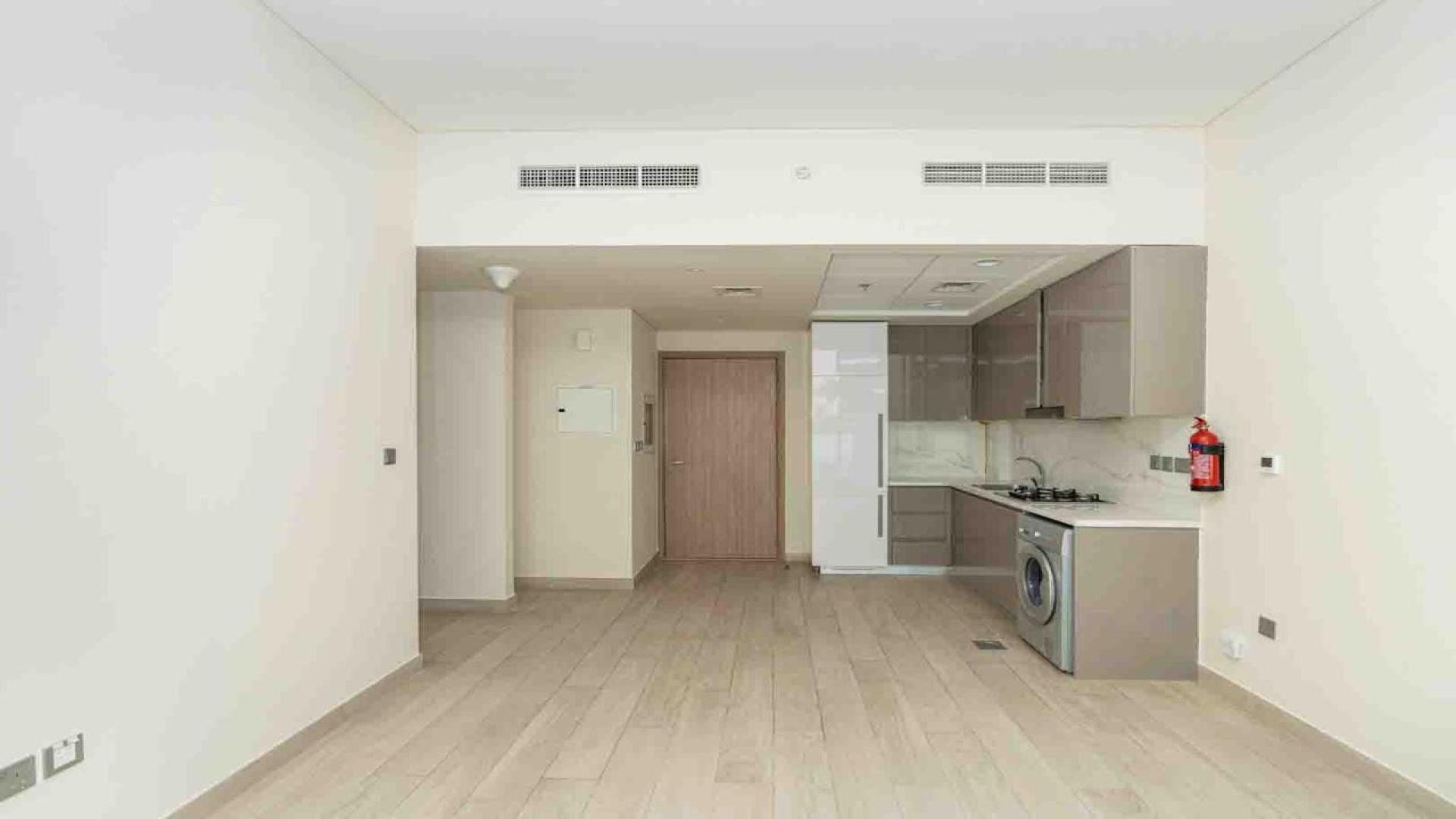 Bright, spacious living area with large windows in Azizi Riviera apartment, Meydan