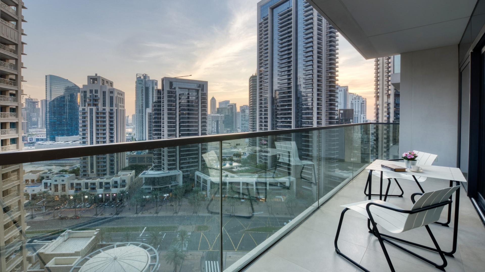 Luxurious furnished bedroom in Act Towers apartment, Downtown, with city view balcony