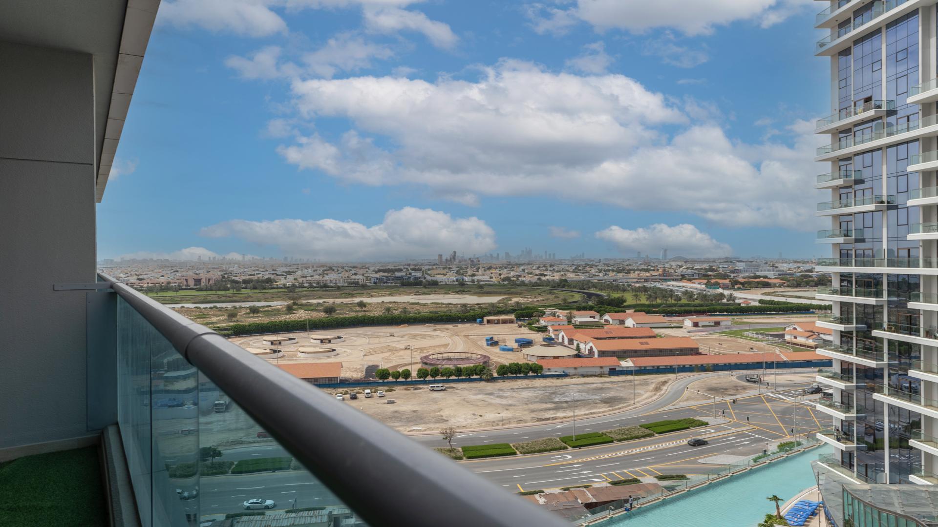 "Stunning view from Elite Business Bay apartment balcony in Business Bay, Dubai skyline visible.",Spacious balcony view in Elite Business Bay apartment for sale, ideal investment opportunity