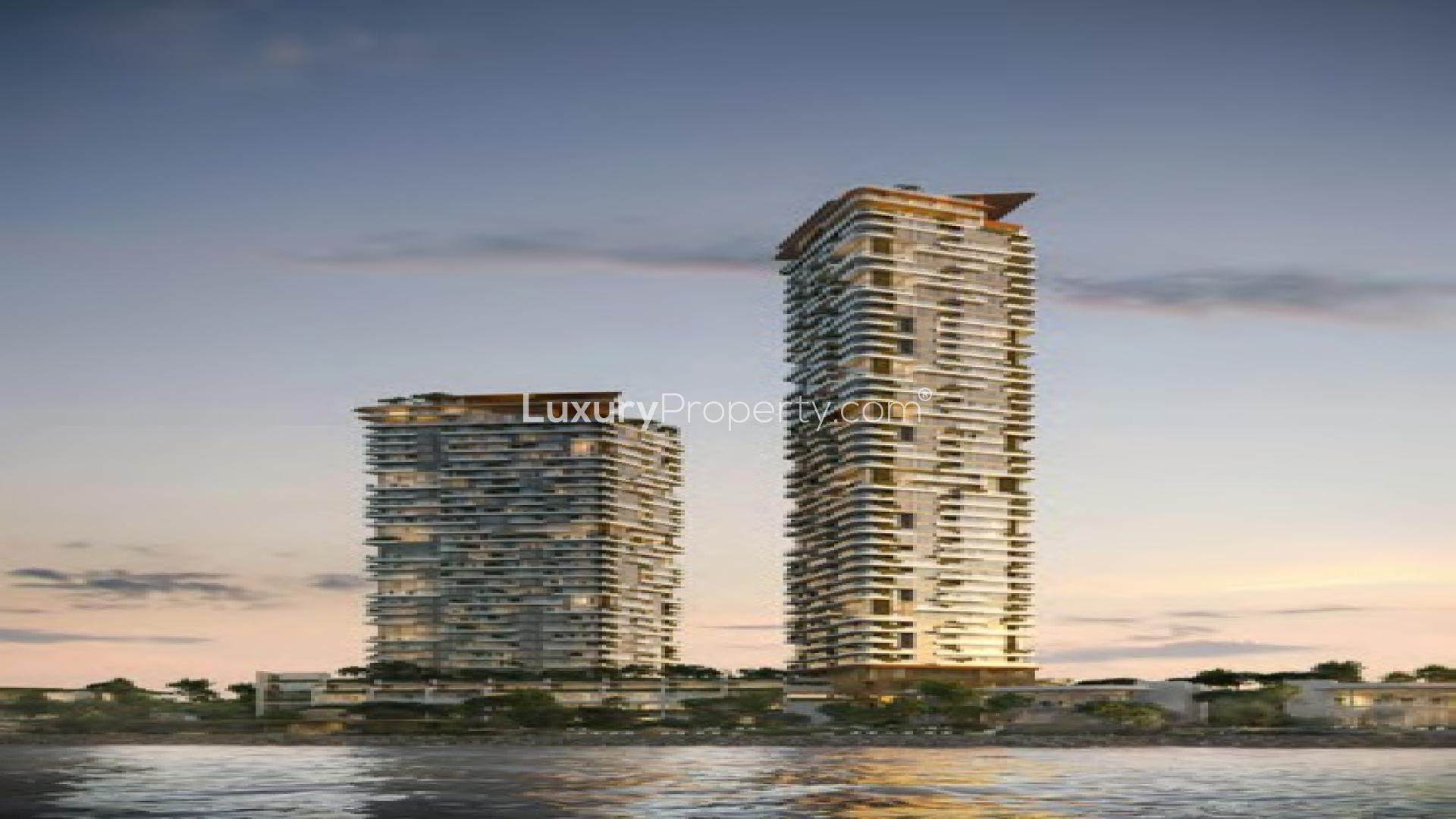 "Luxury Soulever apartment towers with cove and forest views, Dubai Maritime City.",Luxurious living room with ocean view in Soulever apartment, Dubai Maritime City