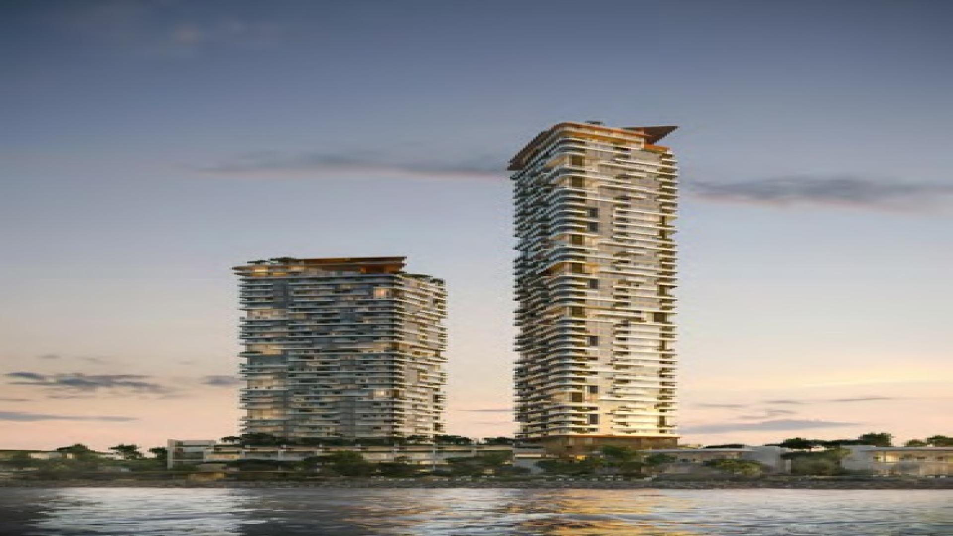 "Luxury Soulever apartment towers with cove and forest views, Dubai Maritime City.",Luxurious living room with ocean view in Soulever apartment, Dubai Maritime City