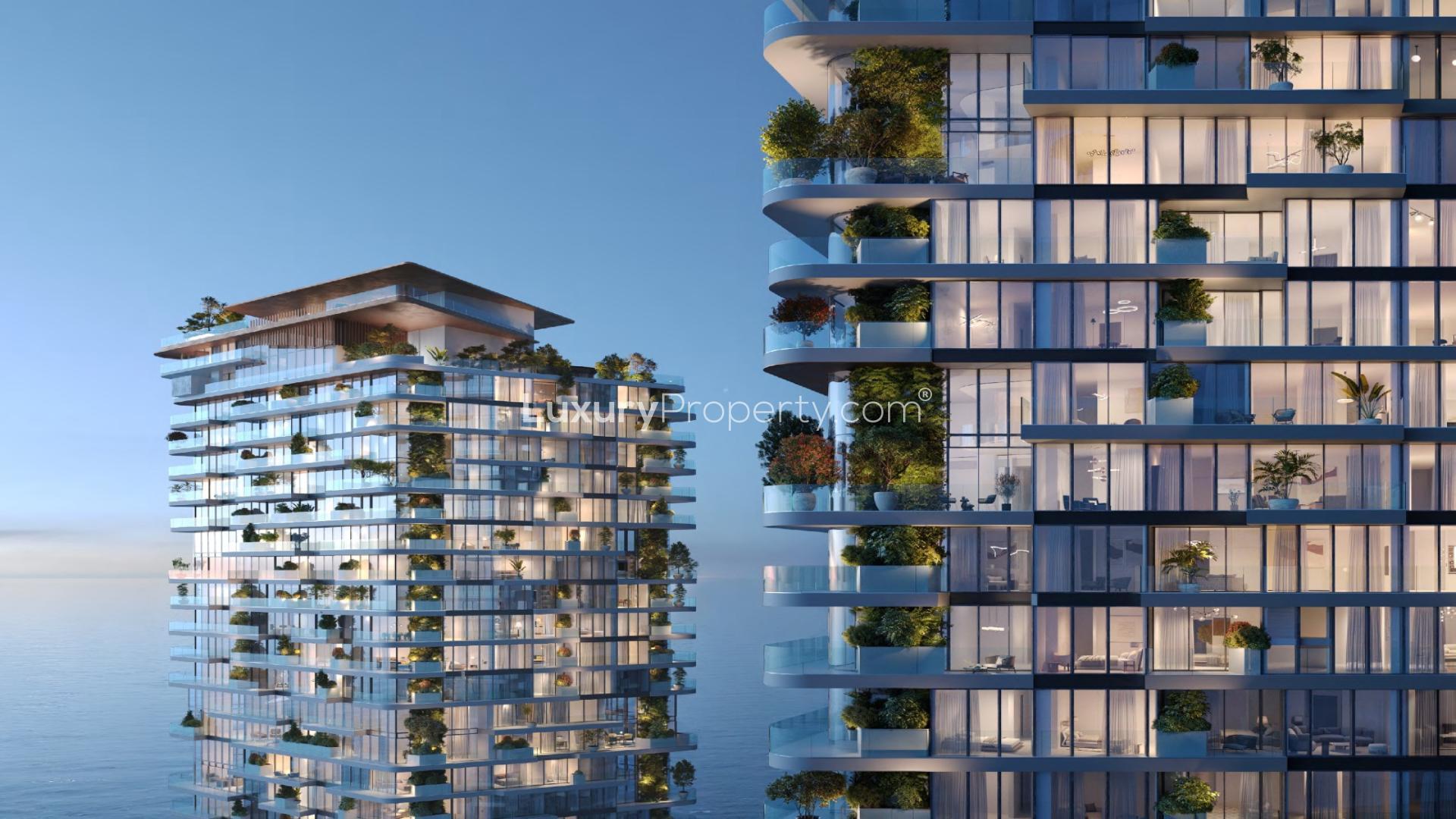 Modern apartment buildings with glass balconies and greenery in Soulever, Dubai Maritime City