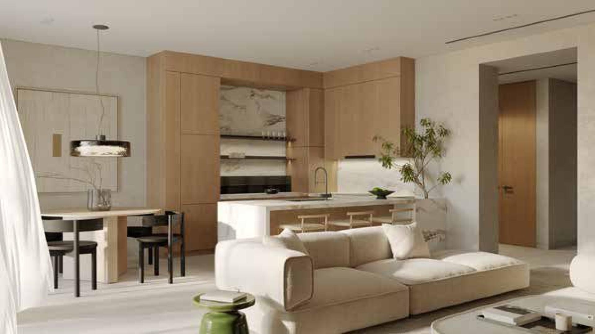 Modern living room in Al Barari apartment with natural light and elegant furnishings