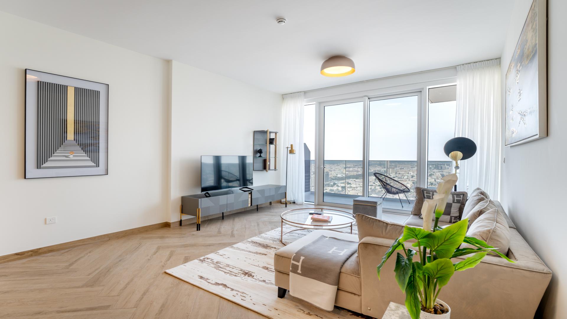 Modern living room in Wasl1 apartment, Al Kifaf, with city view and elegant decor