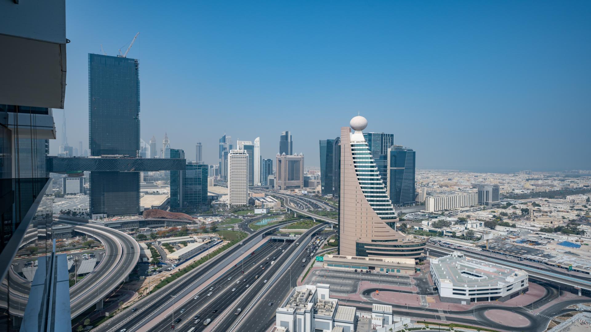 High-rise apartment balcony view of Al Kifaf skyline, Wasl1 community, Dubai