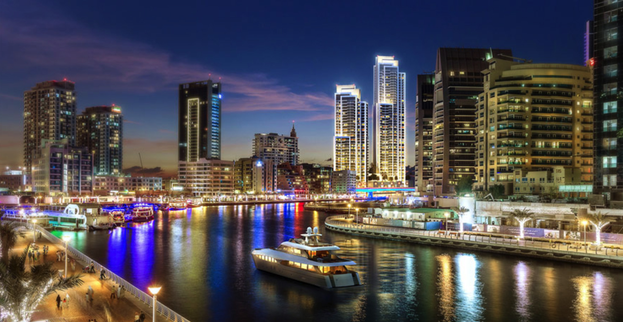 Luxurious waterfront apartment towers at night, 52-42 Dubai Marina skyline reflection