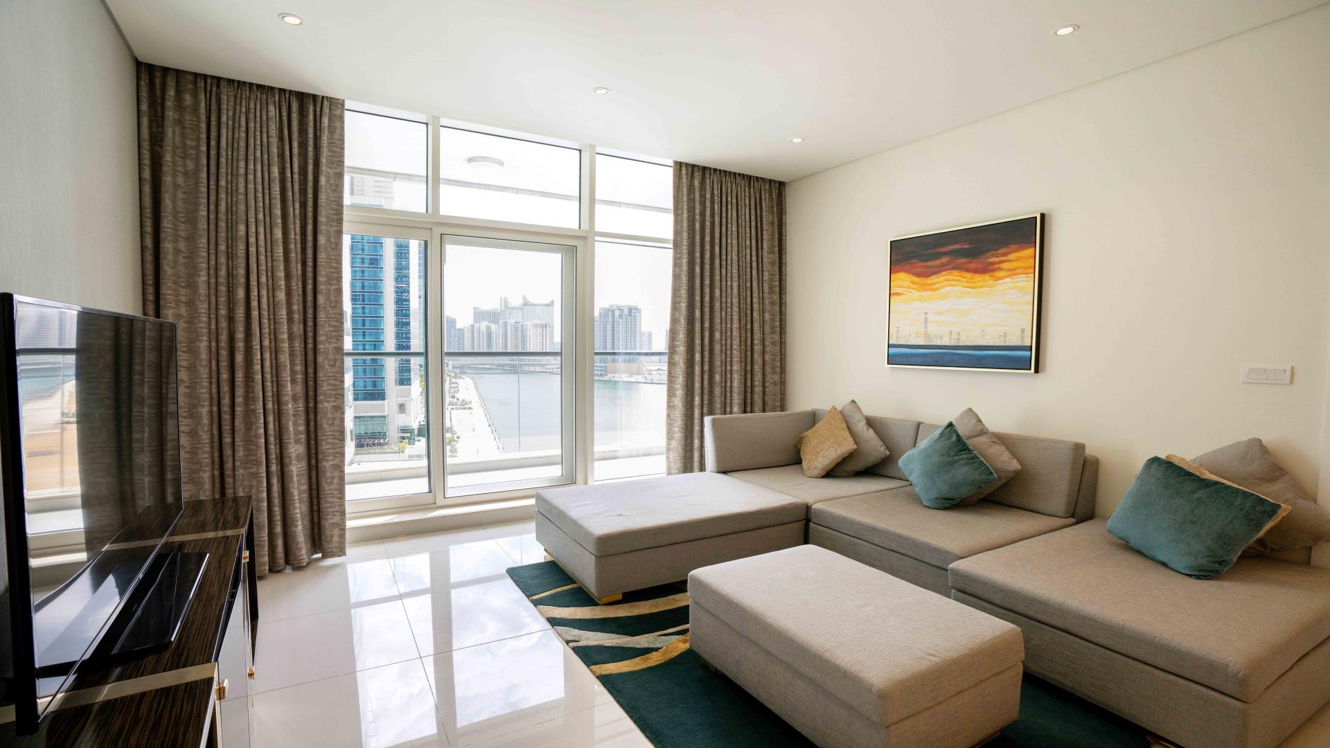 Balcony view from Bays Edge apartment overlooking Business Bay waterfront and cityscape