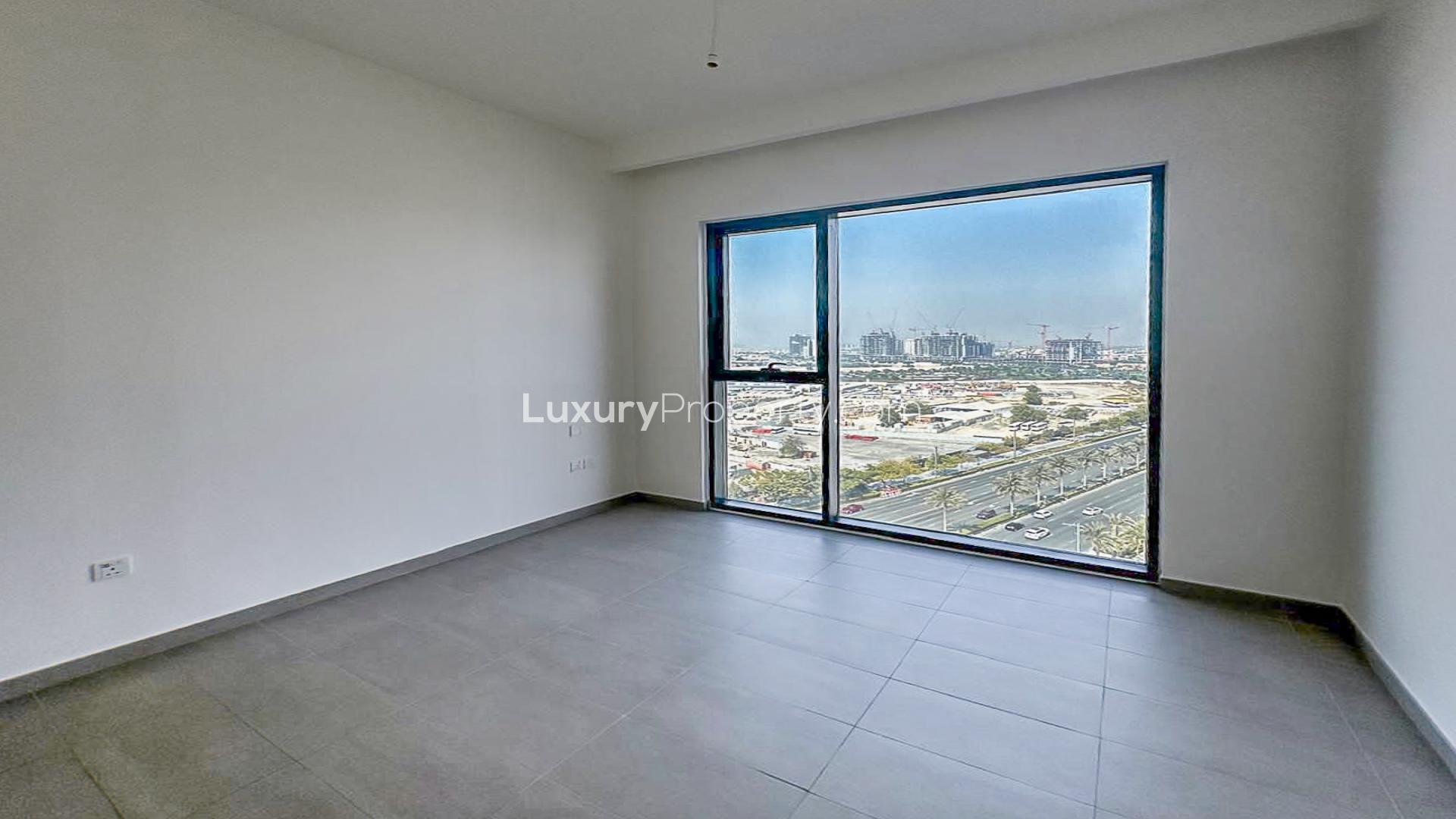 Mid-floor apartment interior with balcony, open layout in Park Ridge, Dubai Hills Estate