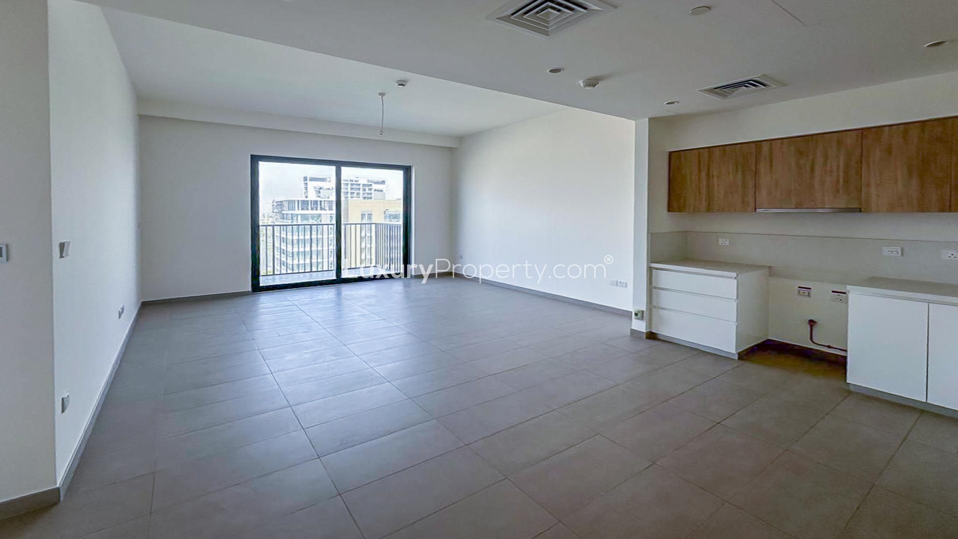 Empty apartment living area with open kitchen in Park Ridge, Dubai Hills Estate
