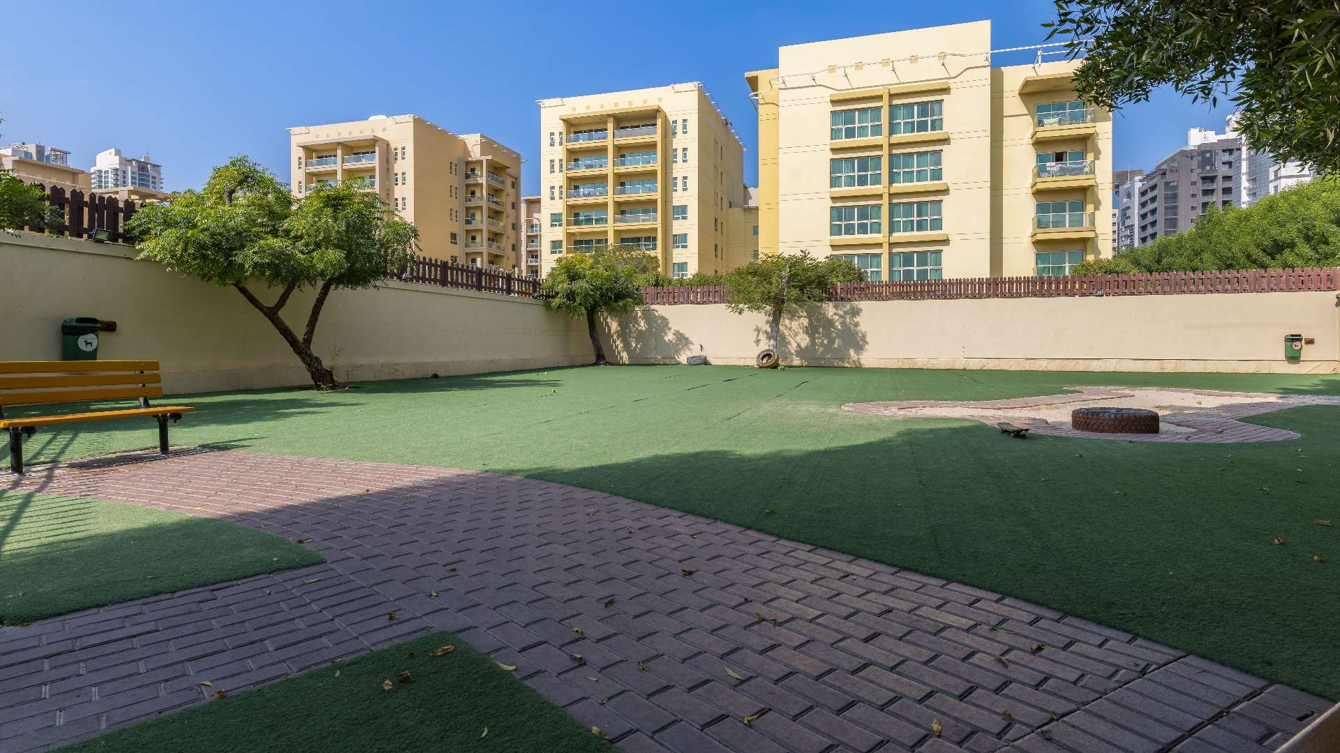 Lush landscaped garden in Al Alka community, near Well-Maintained Greens Apartment for sale