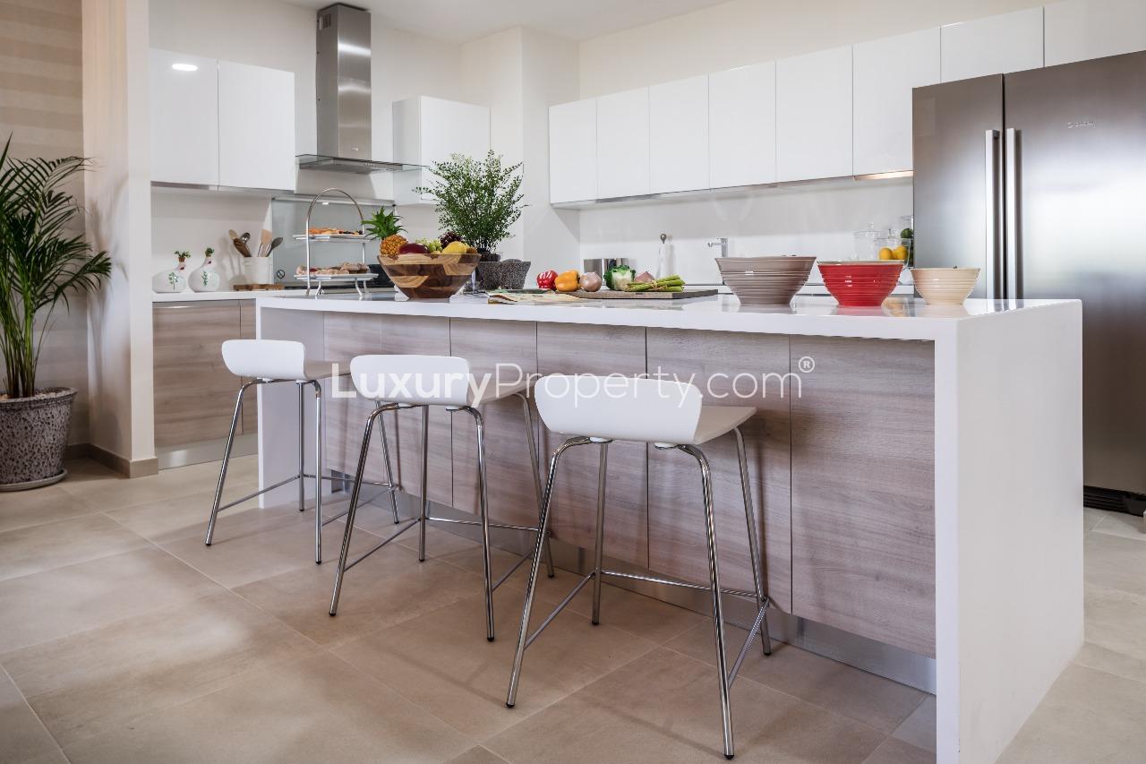 Modern living room in Al Andalus, Jumeirah Golf Estates apartment, with elegant furnishings and decor