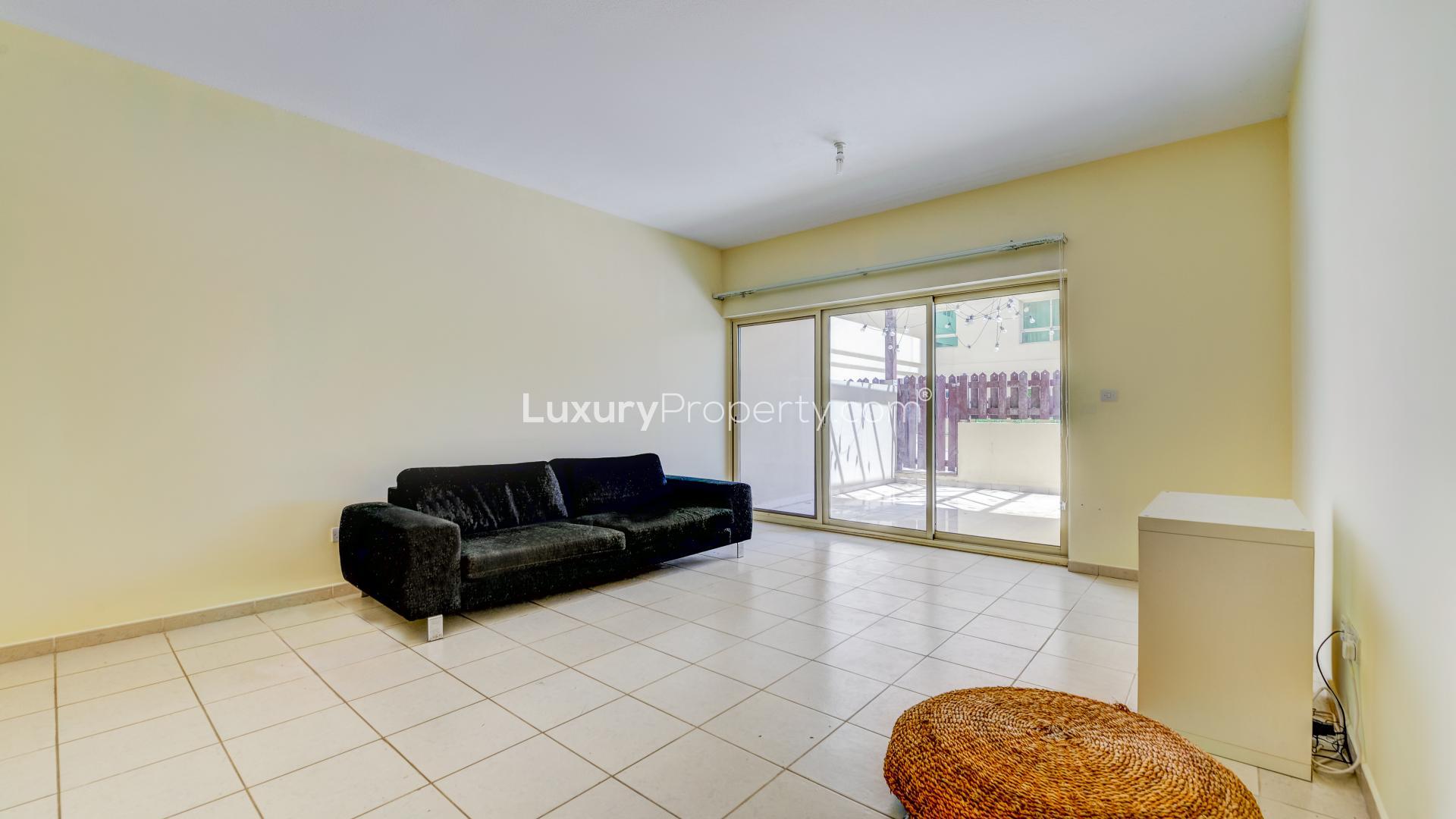 Private courtyard in spacious Al Arta apartment, greenery and modern design, property for sale