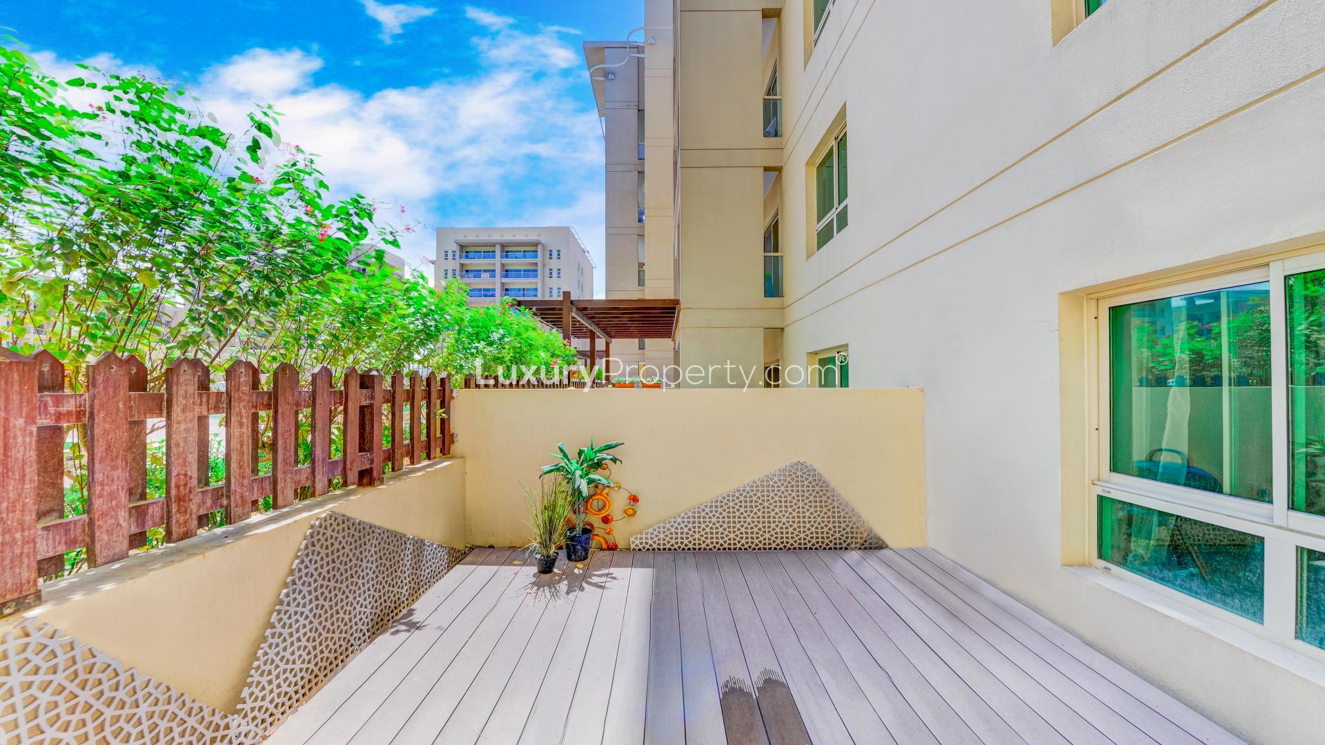 Apartment with private courtyard, spacious layout, Al Arta community, for sale, LP12493