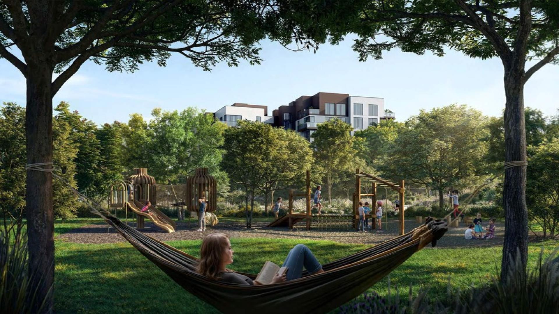 Hammock view of playground and greenery at Ghaf Woods, Dubai Land apartment community