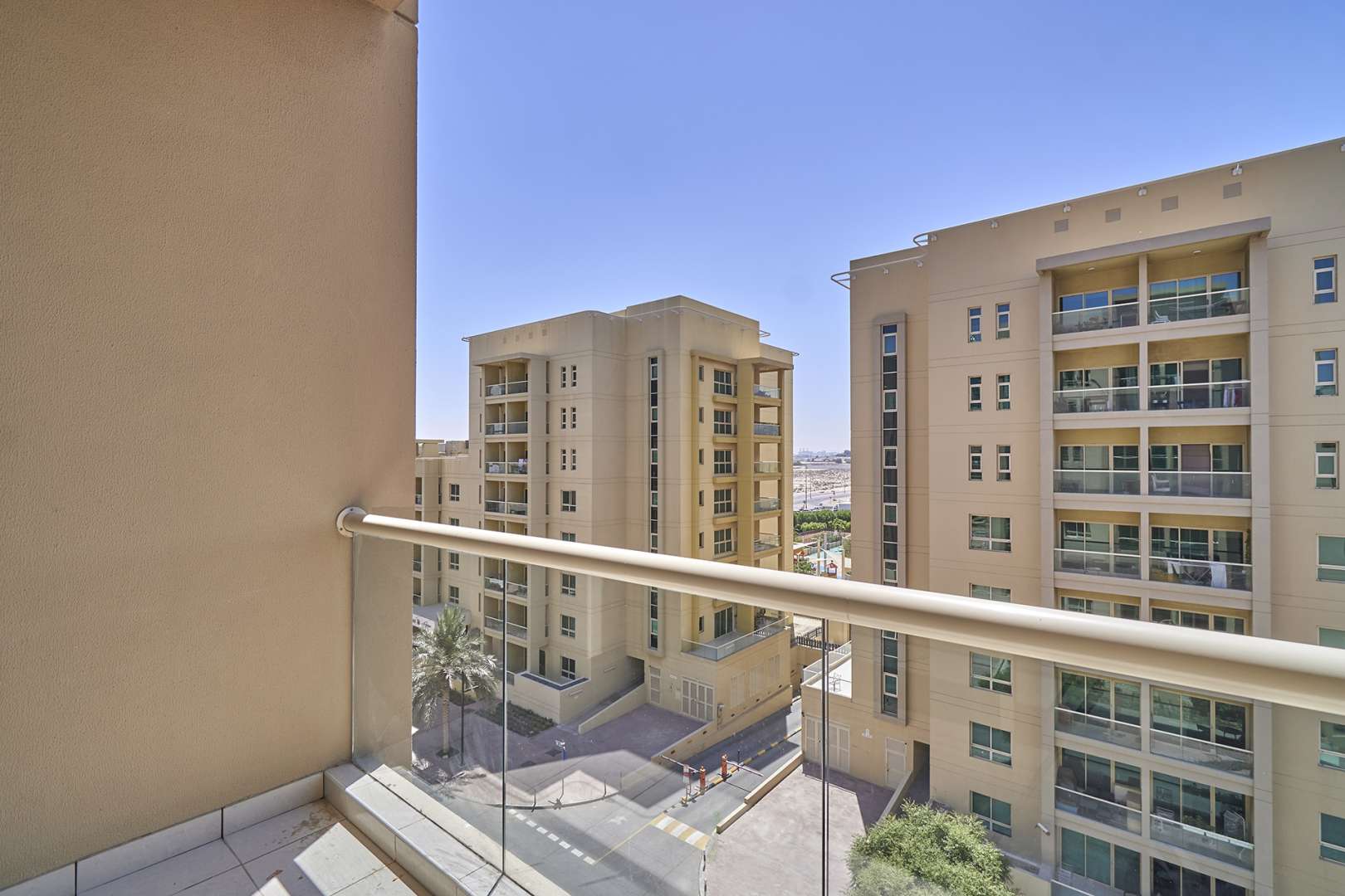 Empty bedroom in 1-bedroom apartment, Al Ghozlan, The Greens, with wooden doors and tiled floor