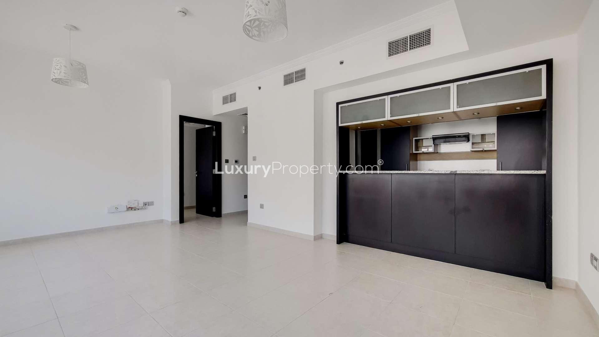 Modern kitchen and living area in Al Majara apartment, Dubai Marina, for sale