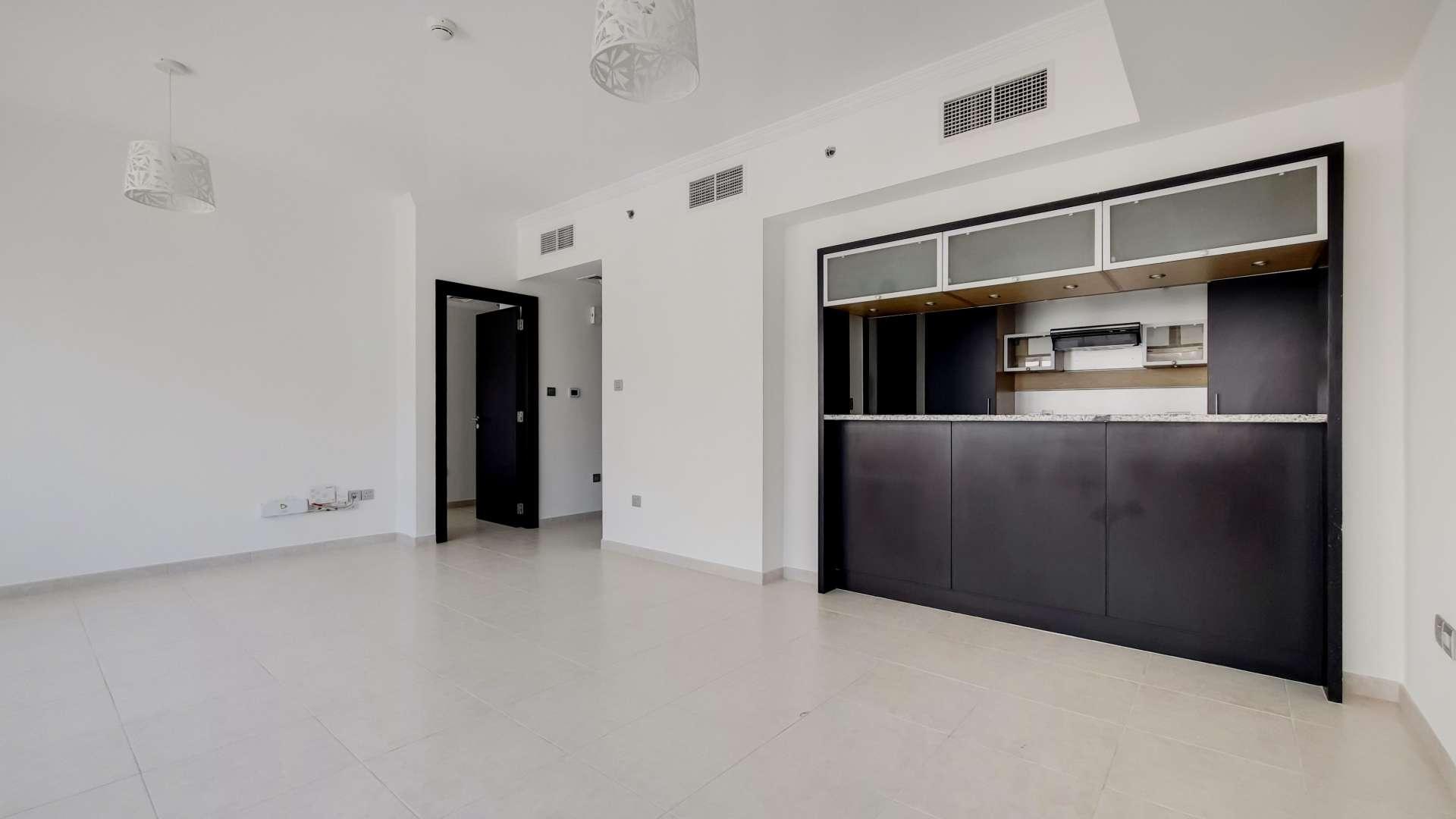 Modern kitchen and living area in Al Majara apartment, Dubai Marina, for sale