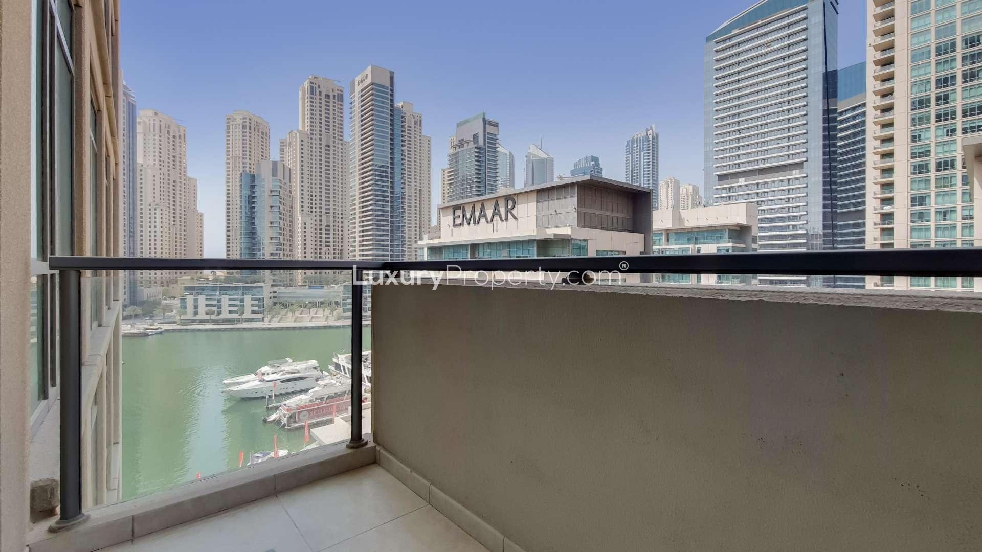 "Bright living room with large windows, Dubai Marina apartment, Al Majara, for sale.",Balcony view of Dubai Marina from Al Majara apartment for sale, Ref No: LP14327