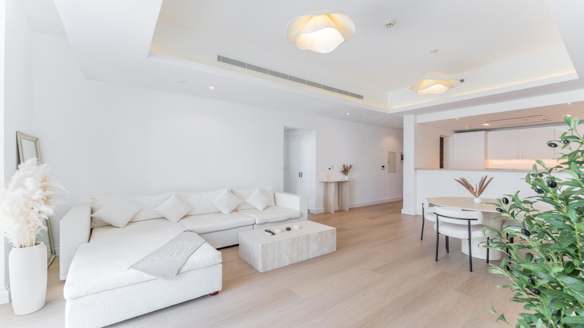 Modern living room in Mada Residences, Downtown Dubai, featuring elegant decor and natural light