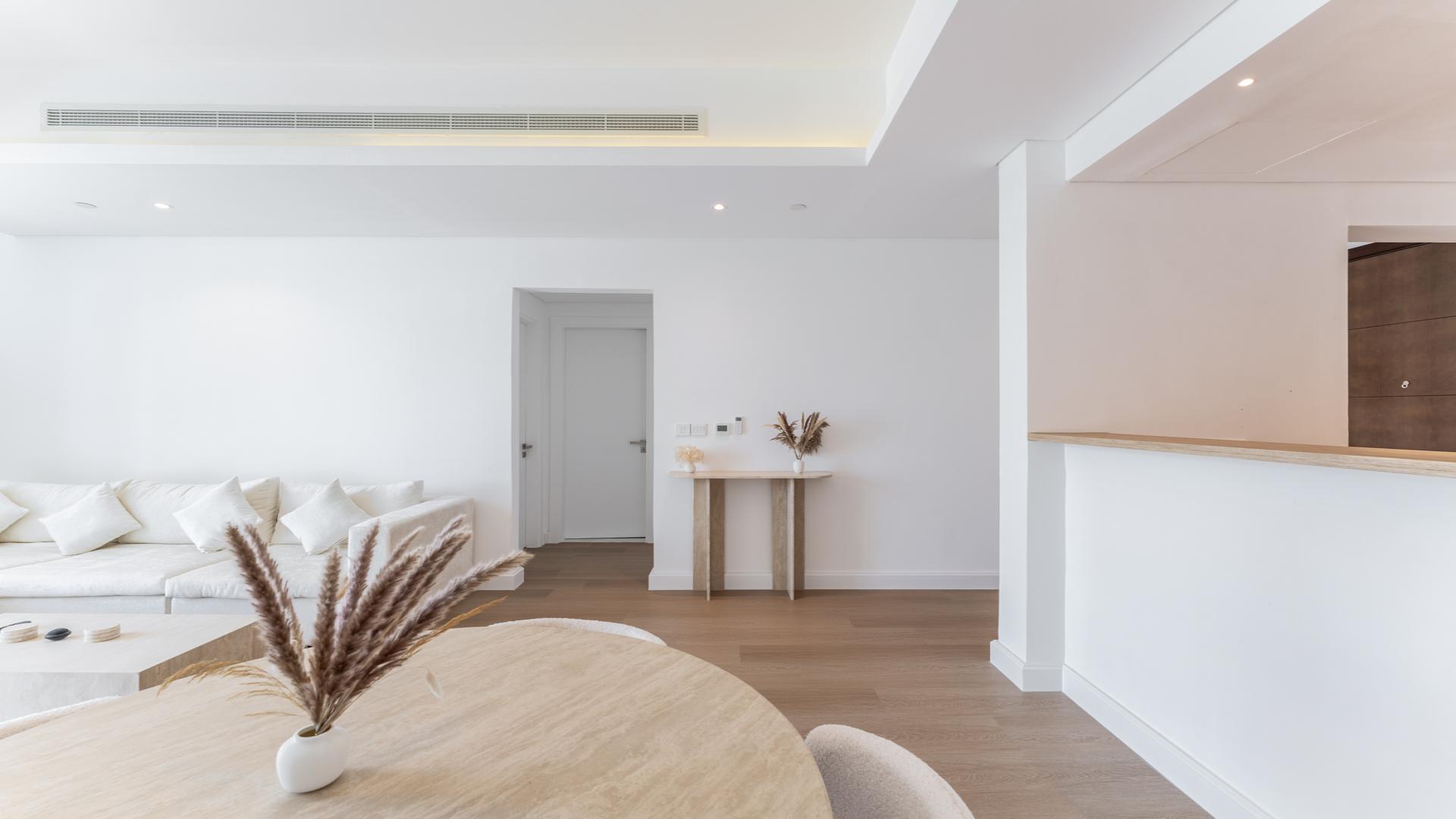 Modern living room in upgraded 1-bedroom apartment, Mada Residences, Downtown Dubai, featuring sleek decor