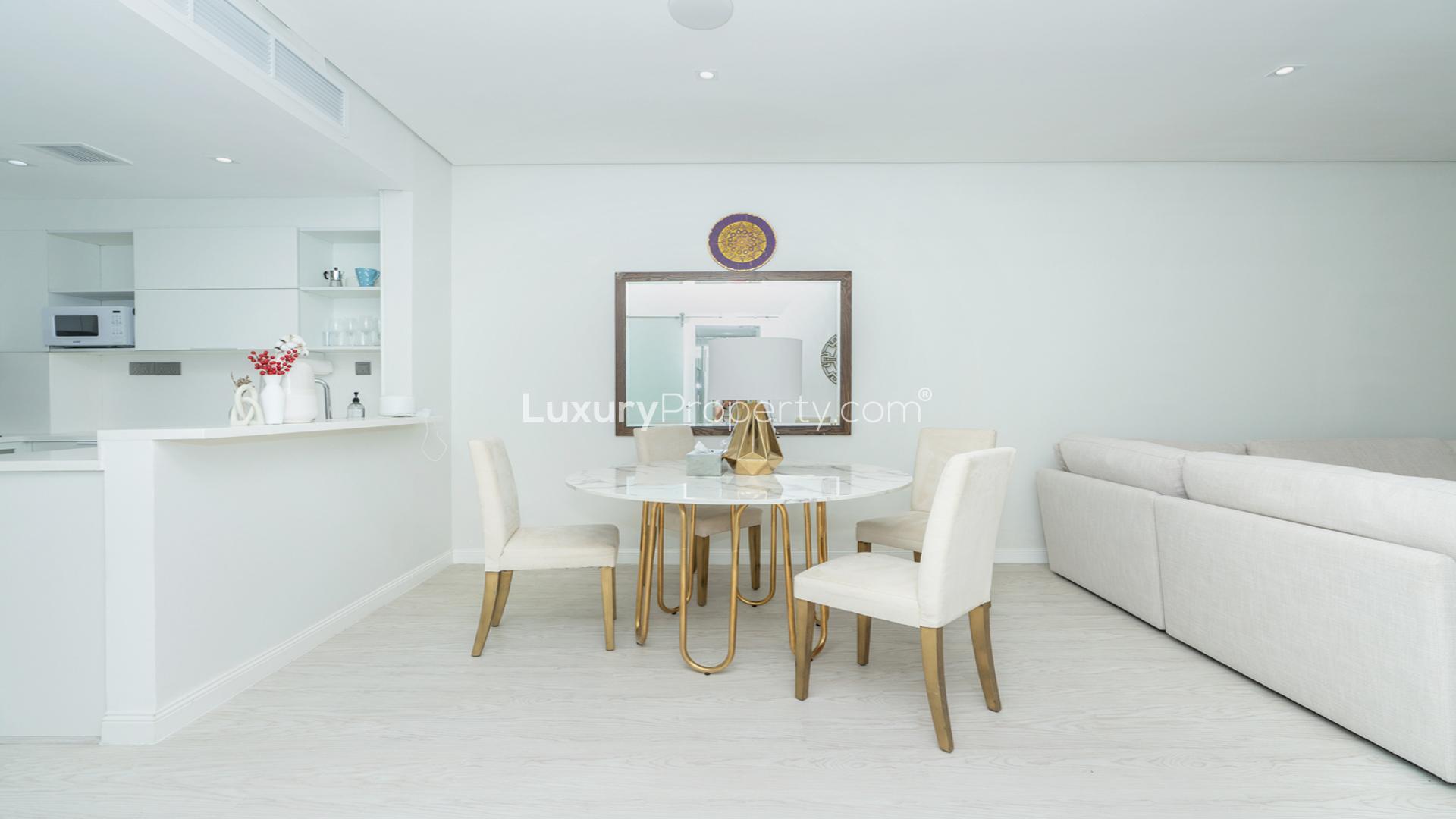 Modern dining area and kitchen in 1-bedroom apartment, The Royal Amwaj, Palm Jumeirah