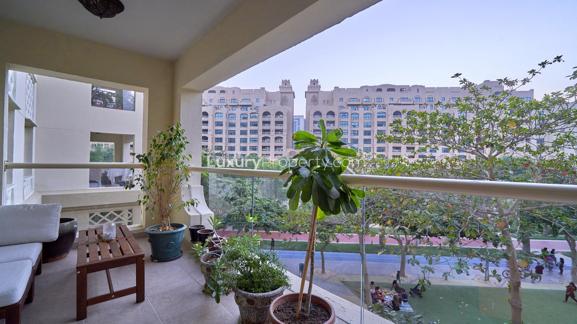 Living room in 1-bedroom apartment, Shoreline Apartments, Palm Jumeirah, with cozy decor and plants