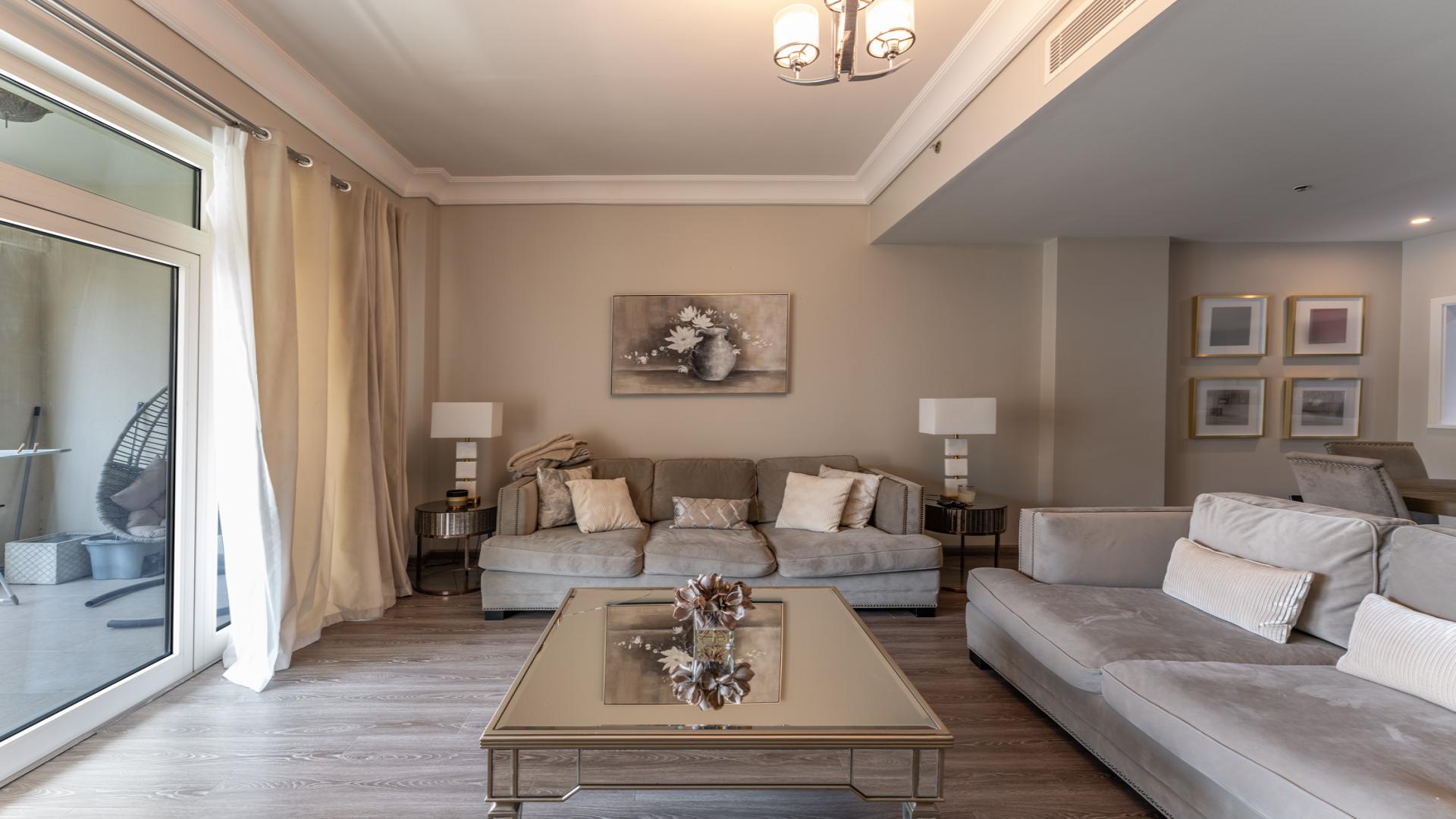 Modern living room in one-bedroom apartment, Al Shahla, Palm Jumeirah, with elegant furnishings