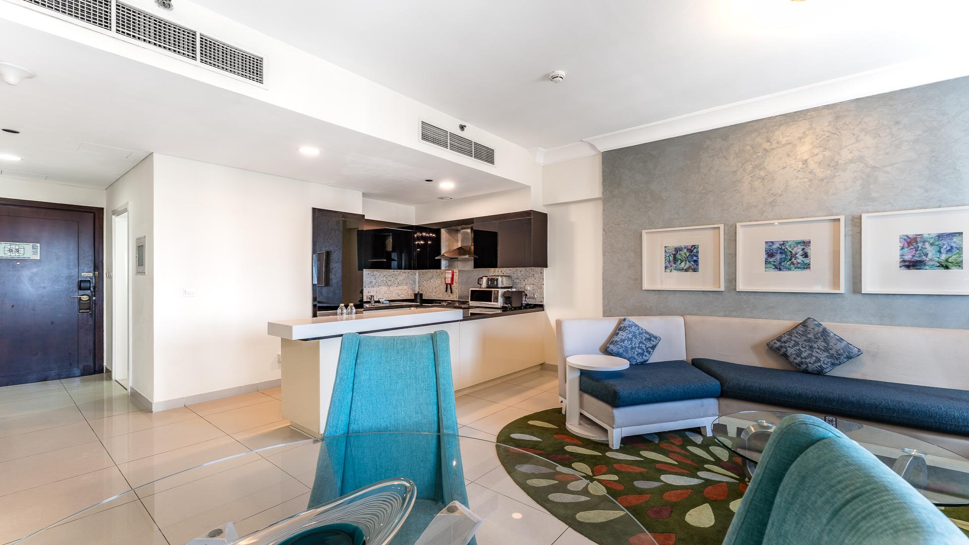 Furnished living room and kitchen in Damac Maison, Downtown Dubai apartment for sale