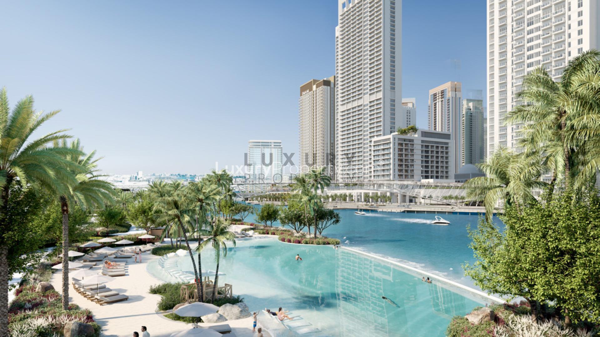Dubai Creek Harbour apartment view with lush park and modern high-rise buildings