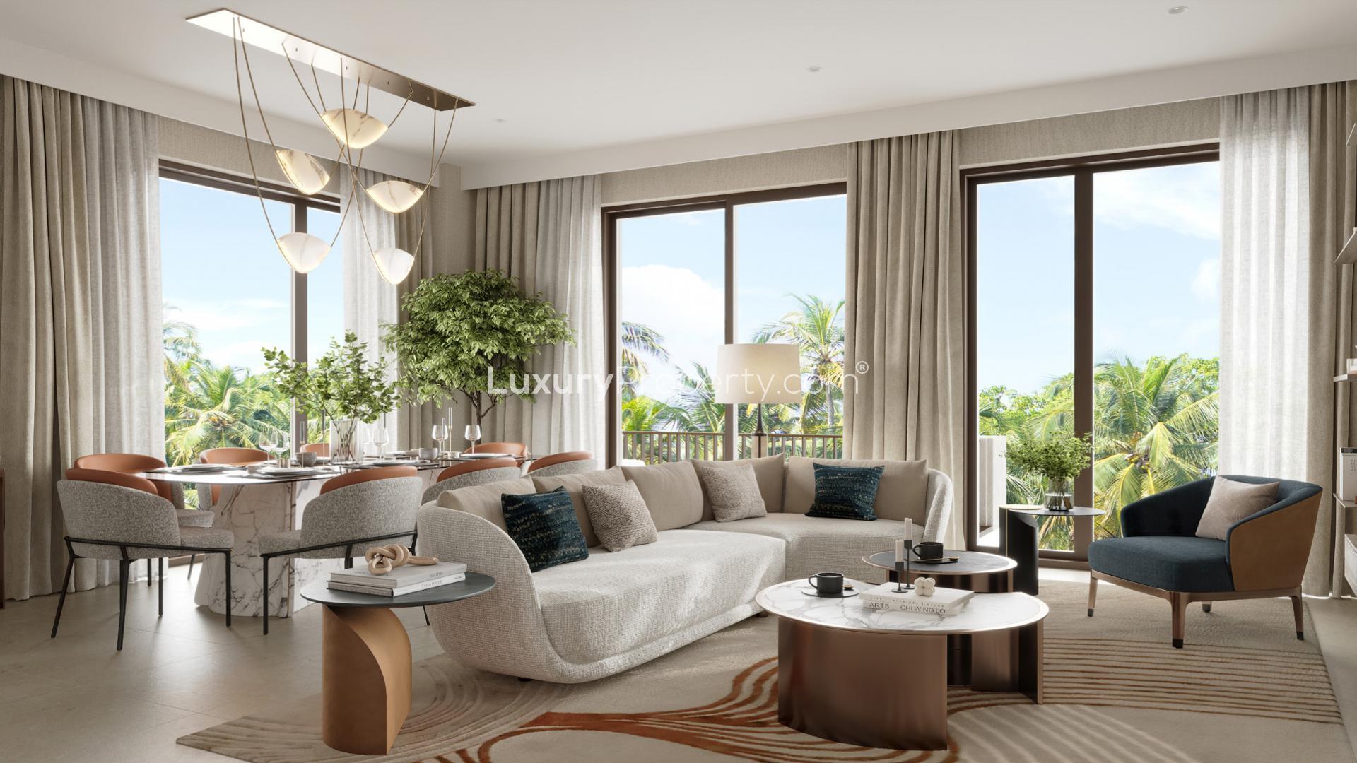 Modern apartment building at Mangrove, Creek Beach, Dubai Creek Harbour, surrounded by lush greenery