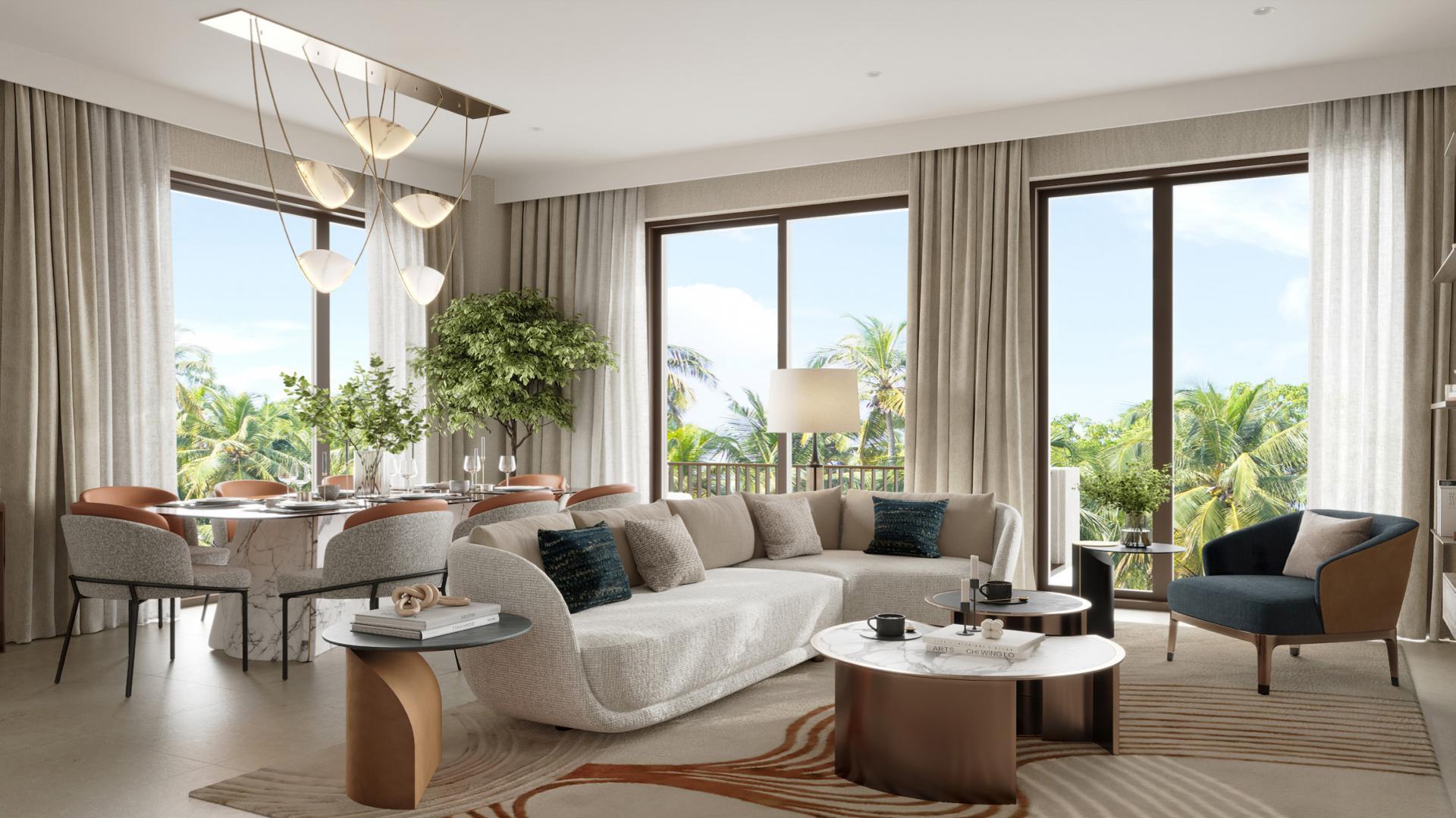 Modern apartment building at Mangrove, Creek Beach, Dubai Creek Harbour, surrounded by lush greenery