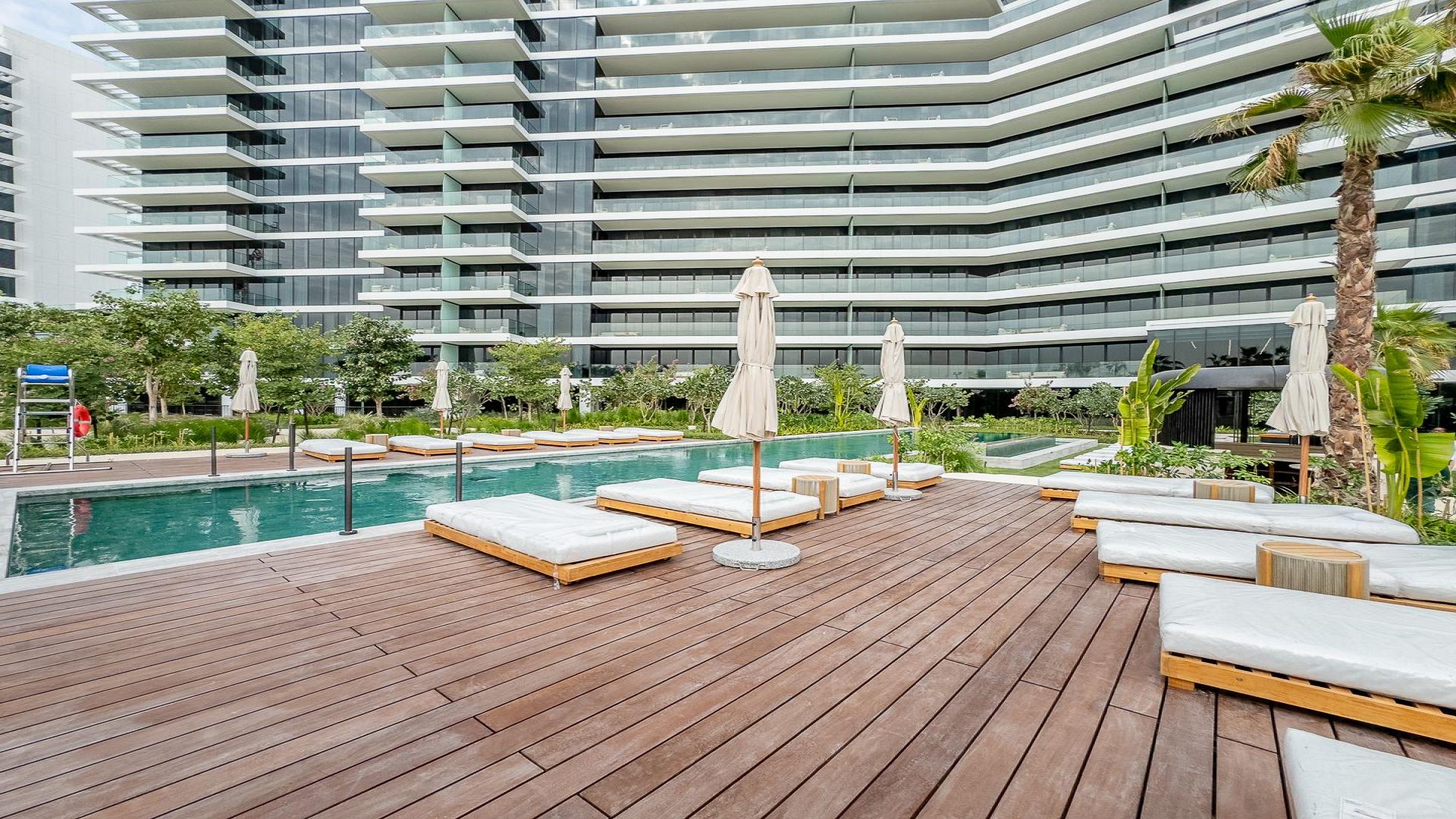 Modern studio apartment living area at Kempinski Residences, Al Jaddaf with city views