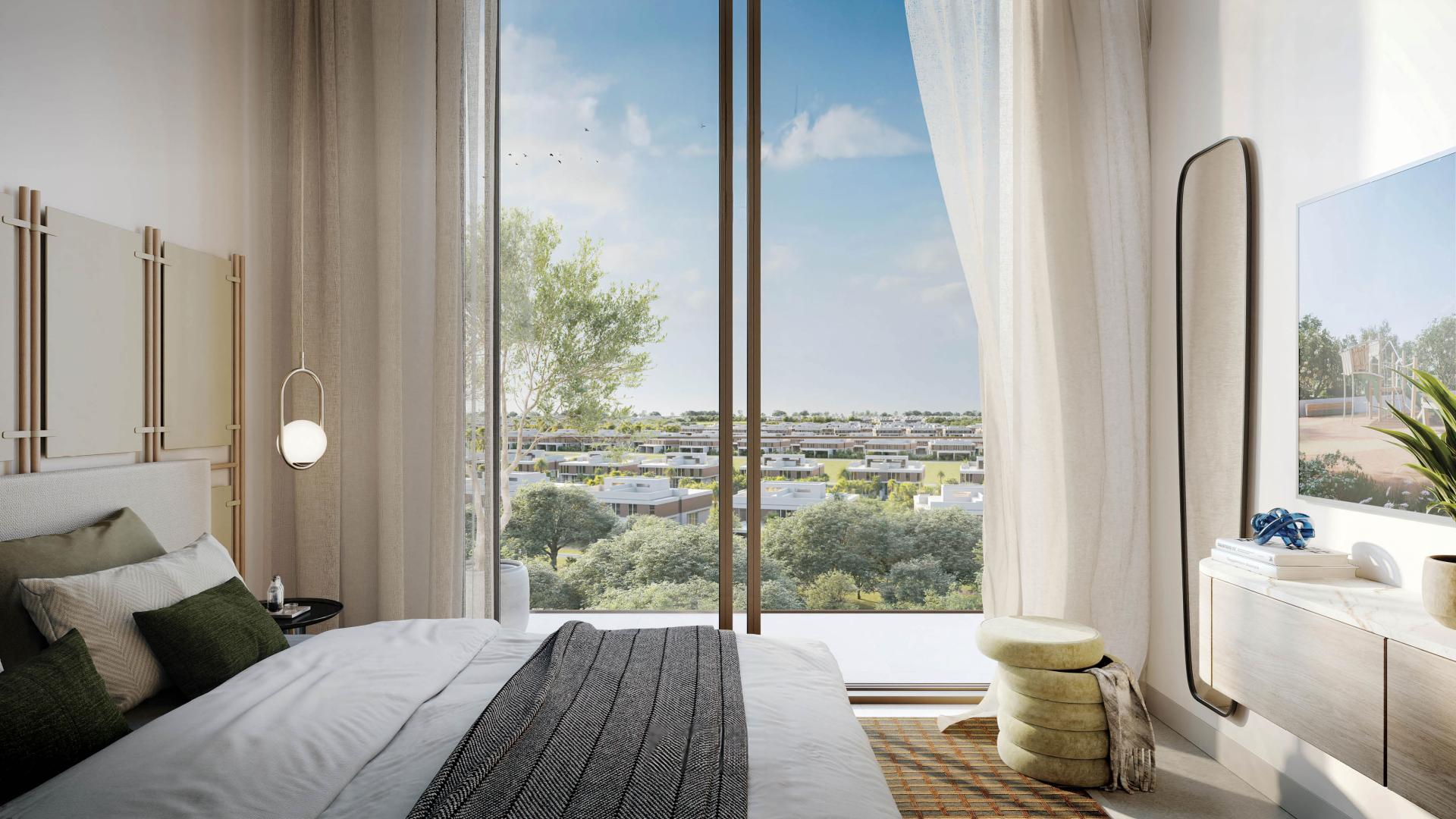 Elegant living room in Dubai Hills Estate apartment, featuring modern decor and large windows