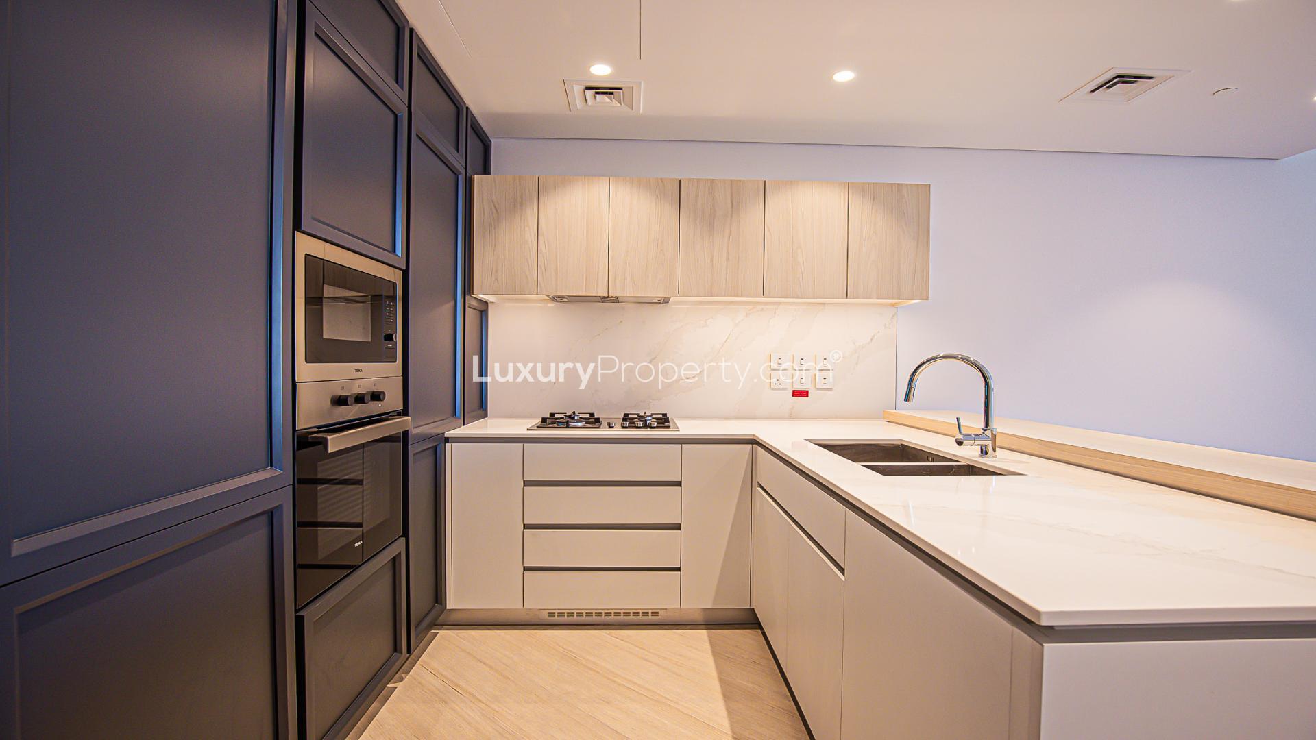 Modern kitchen in Wilton Park Residences apartment, featuring sleek cabinetry and island counter