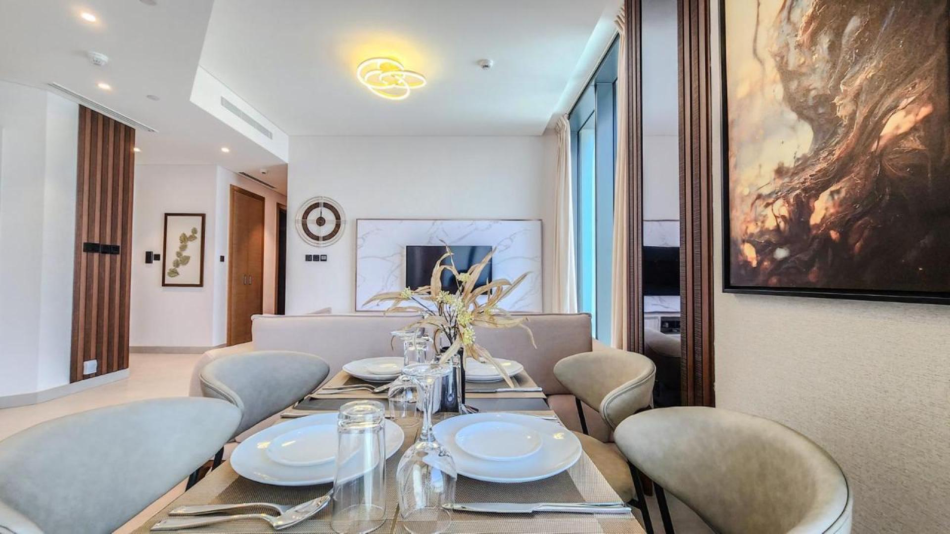 Modern open-plan living area in Sobha Hartland apartment, Mohammed Bin Rashid City