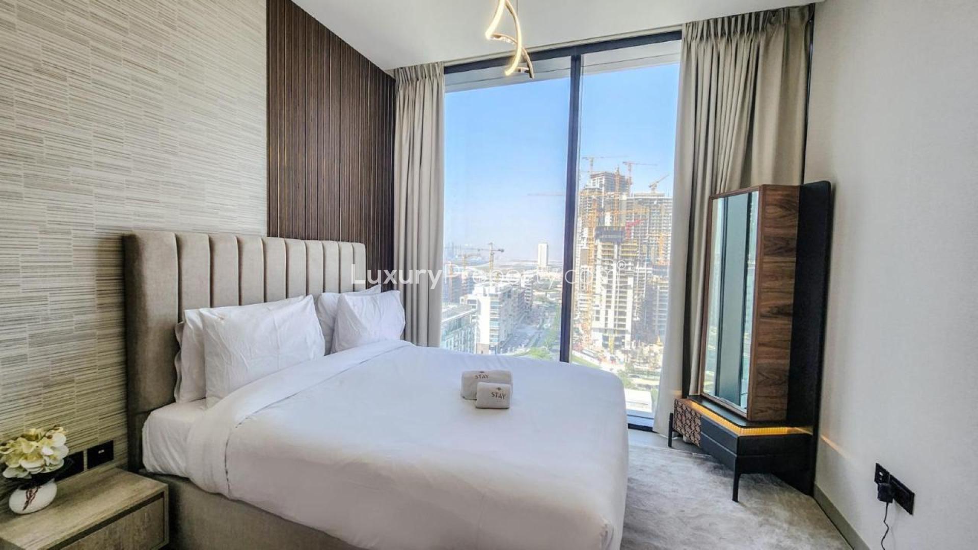 Modern living room in Sobha Hartland apartment, featuring city view and elegant decor