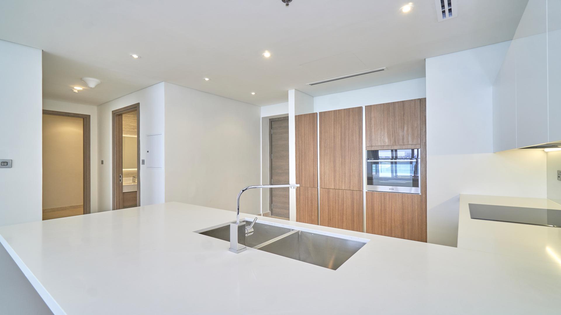 Modern kitchen in one-bedroom apartment, Anwa, Maritime City, with sleek cabinetry and appliances