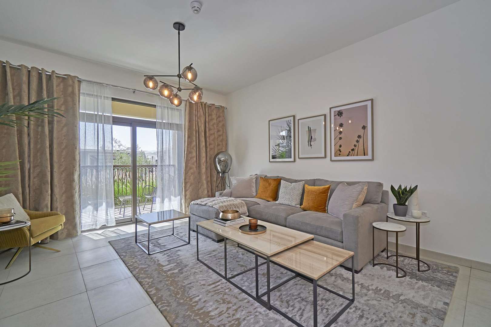 Stylish living room in Asayel Building 2 apartment with modern decor and balcony view