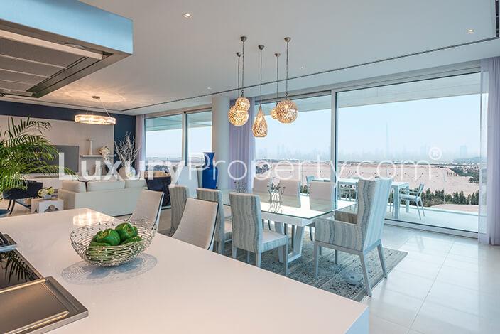 Luxurious living room with lake view in Ashjar, Al Barari one-bedroom apartment